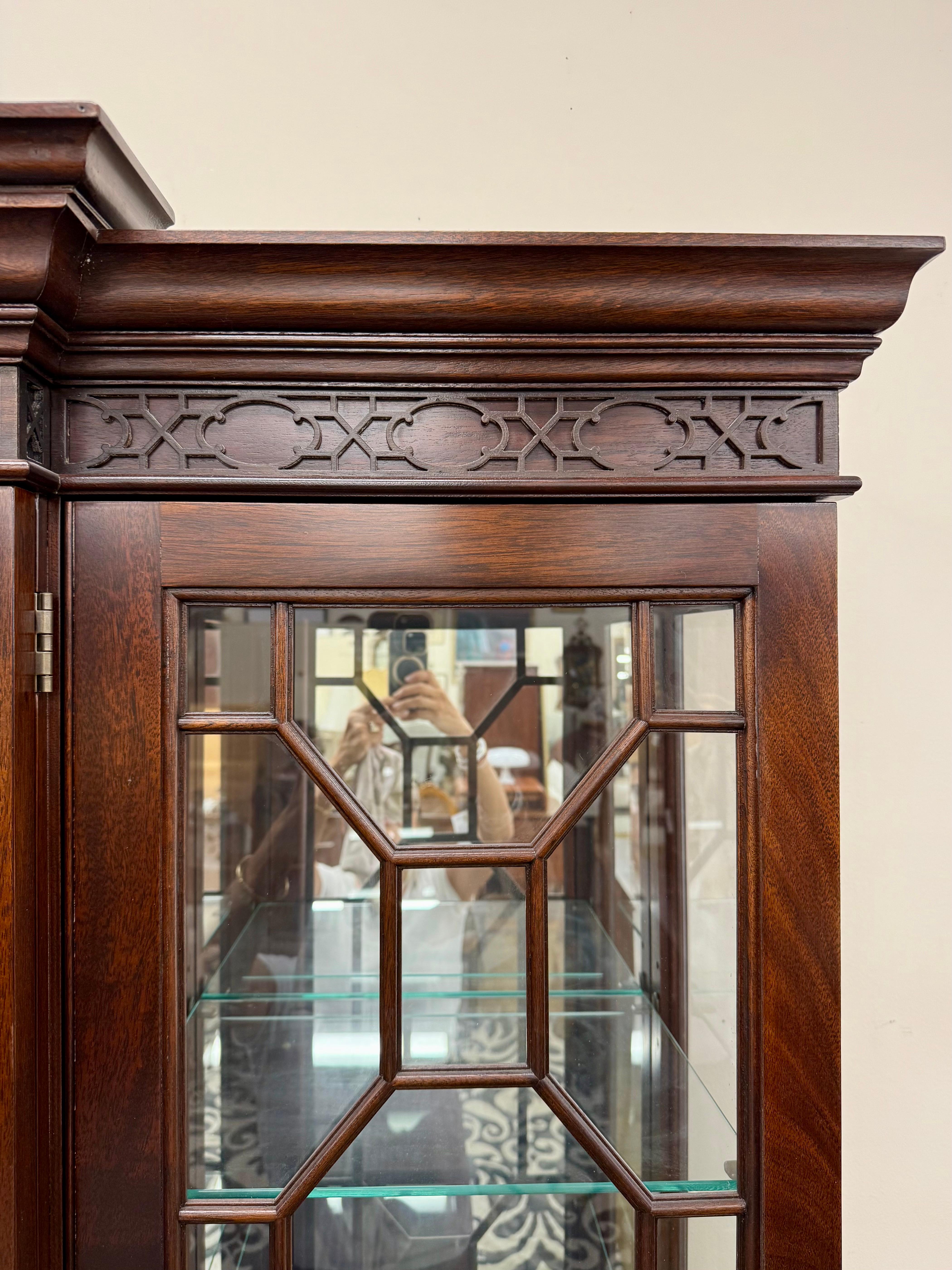 Stunnng Stickley Furniture stately breakfront done in mahogany wood with inlay throughout.  The highest level of craftsmanship and all original brass pulls are present.  The breakfront is a statement piece that is fully capable of house all of your