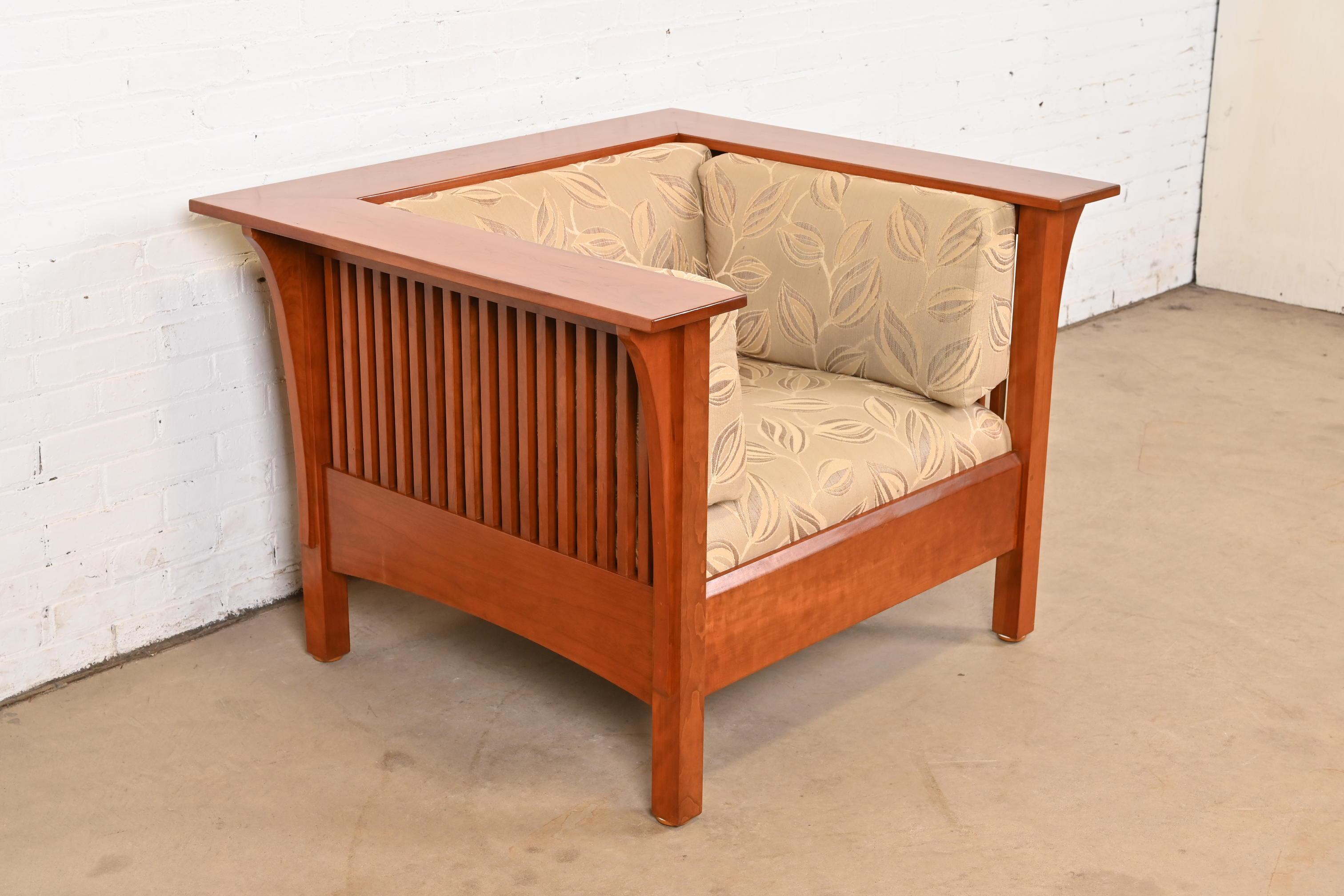 An exceptional Mission or Arts & Crafts style spindle club chair or lounge chair

By L. & J.G. Stickley

USA, Early 21st Century

Solid cherry wood frame, with upholstered cushions. 

Measures: 42.5