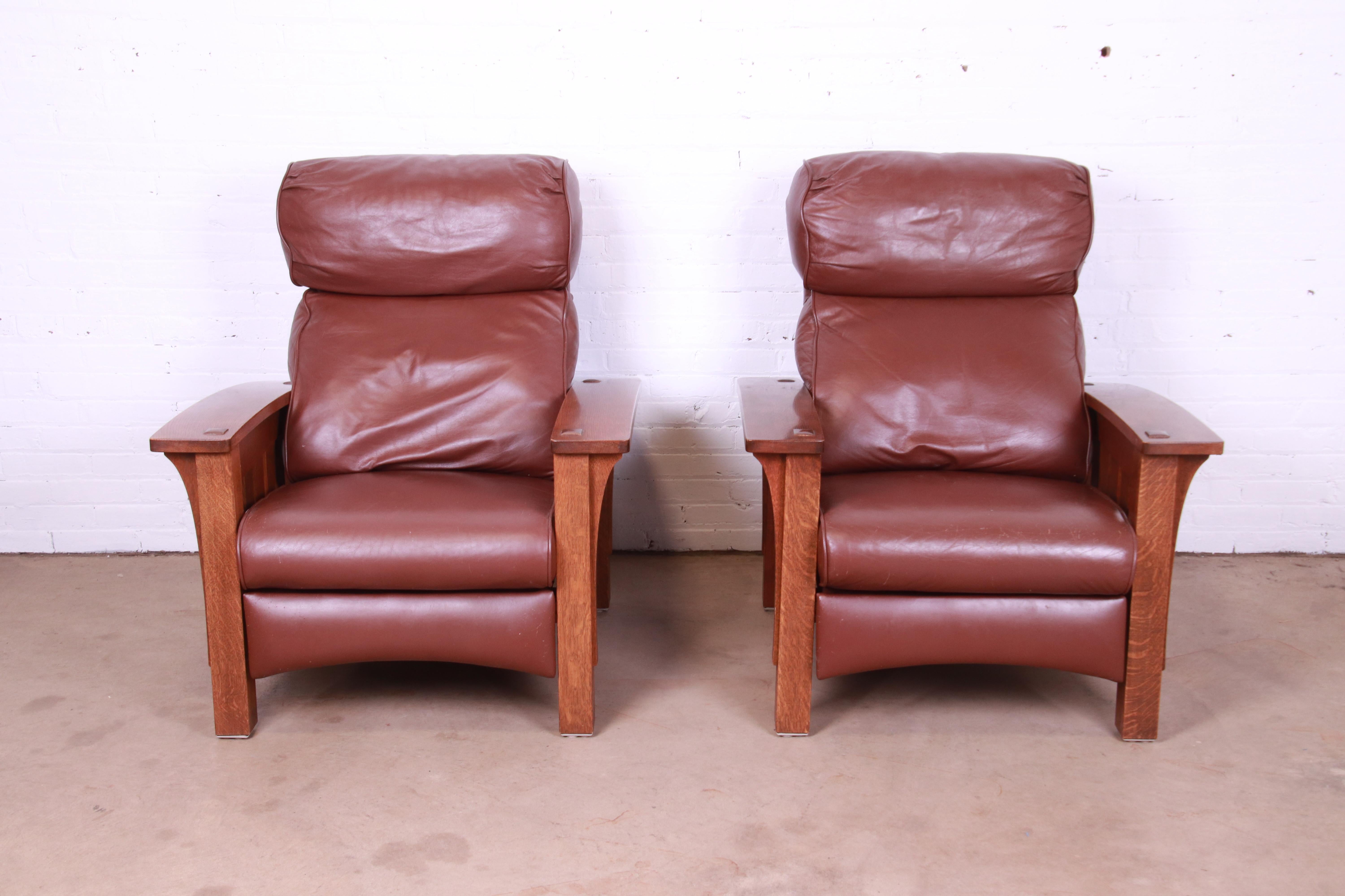 A gorgeous pair of Mission or Arts & Crafts style bow arm Morris reclining lounge chairs

By Stickley, 