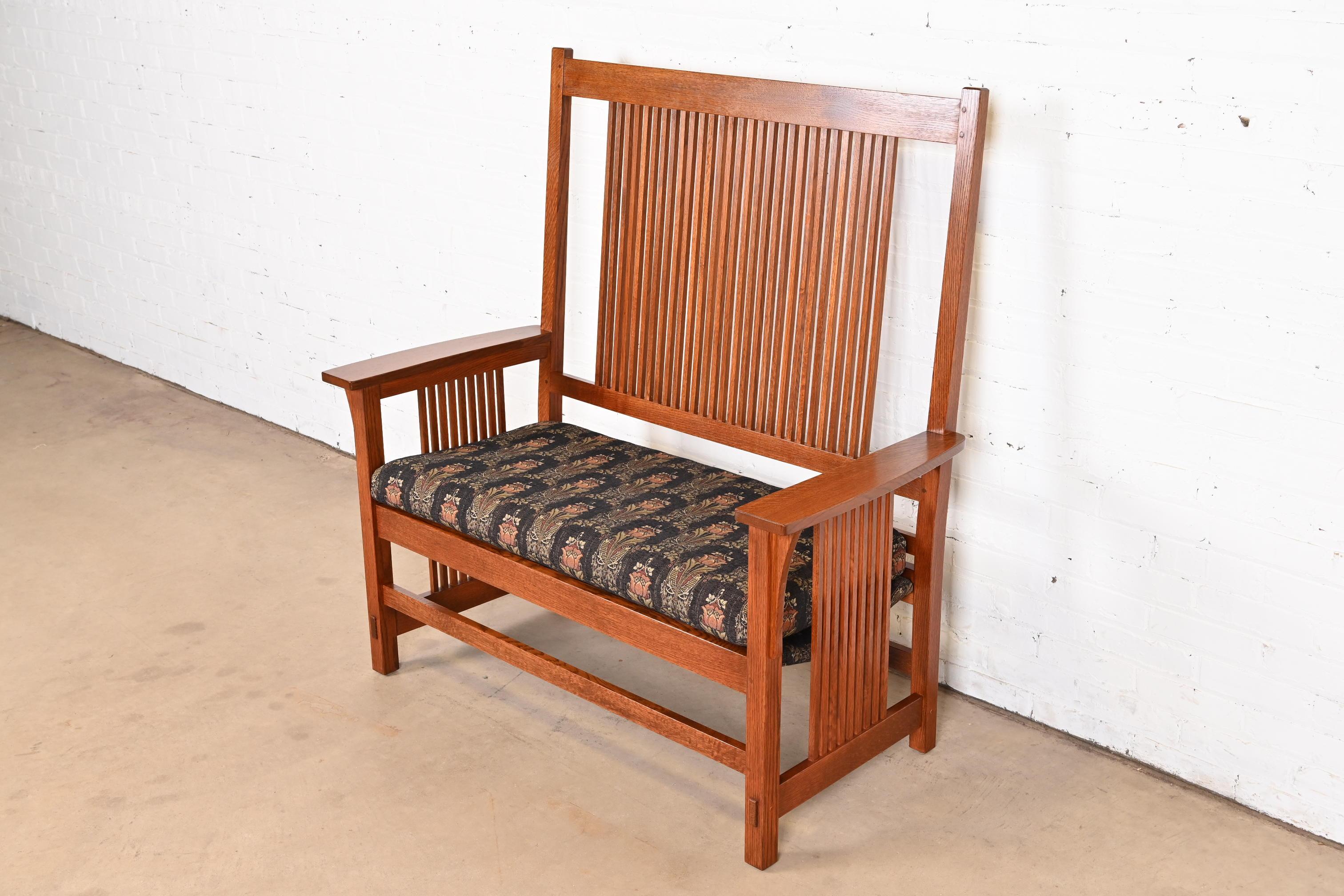 A gorgeous Mission or Arts & Crafts style spindle bench, settee, or love seat

By L. & J.G. Stickley

USA, Circa Late 20th Century

Solid quarter sawn oak, with William Morris style upholstery.

Measures: 48.5