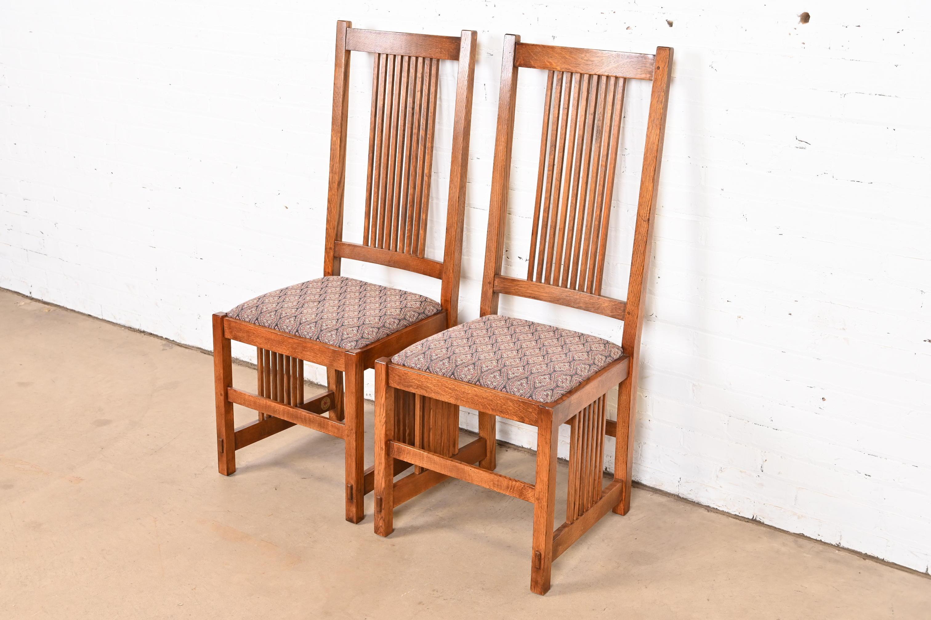 An exceptional pair of Mission or Arts & Crafts style dining chairs or side chairs

By L. & J.G. Stickley

USA, Circa Late 20th Century

Solid quarter sawn oak frames, with upholstered seats.

Measures: 19
