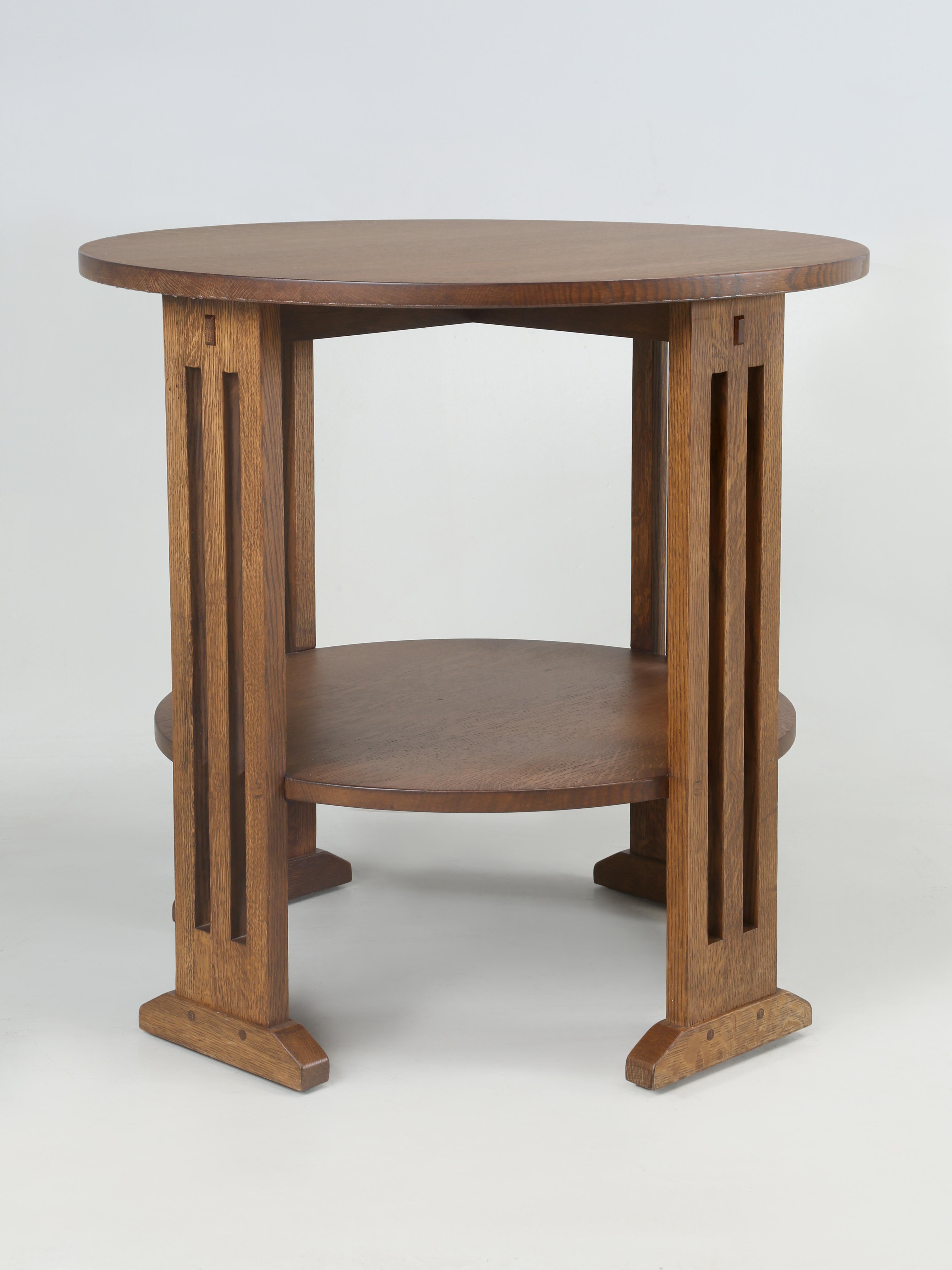 Stickley re-issued of their circa 1904 Occasional Table or End Table in Rift-Cut and Quarter-Sawn White Oak. Model number 89 663. 
Described by Stickley as; an elegant occasional table with one fixed shelf and subtle shoe foot design. The small
