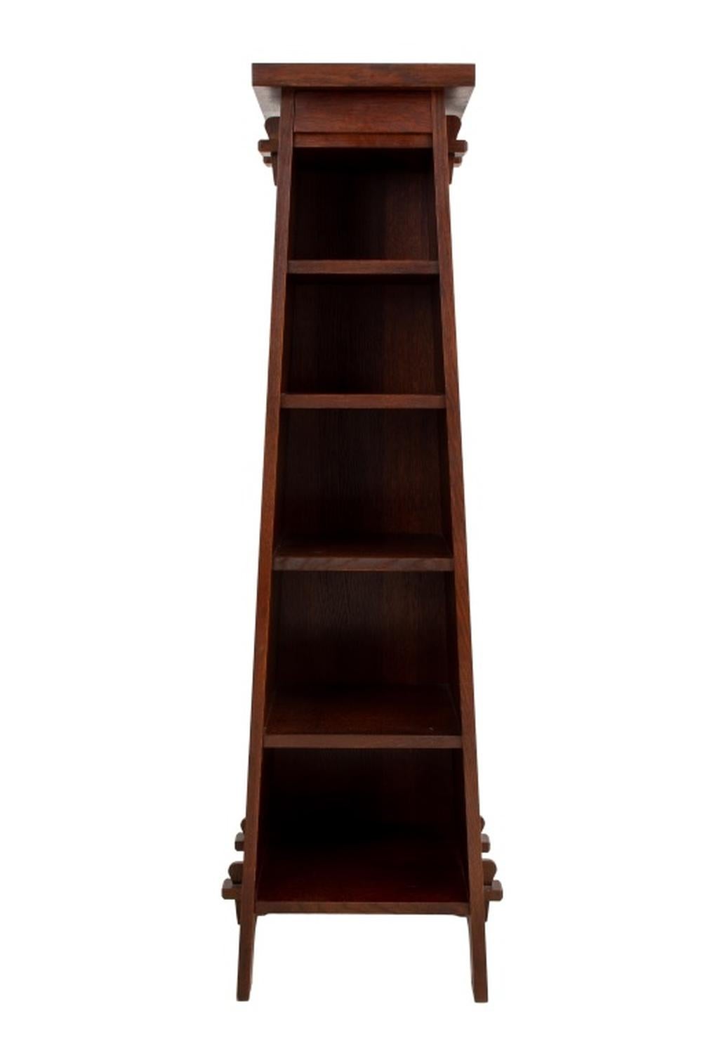 Stickley Roycroft Oak Magazine Pedestal Bookshelf, canted sides with six shelves and one drawer, impressed  Roycroft orb mark to side. 63