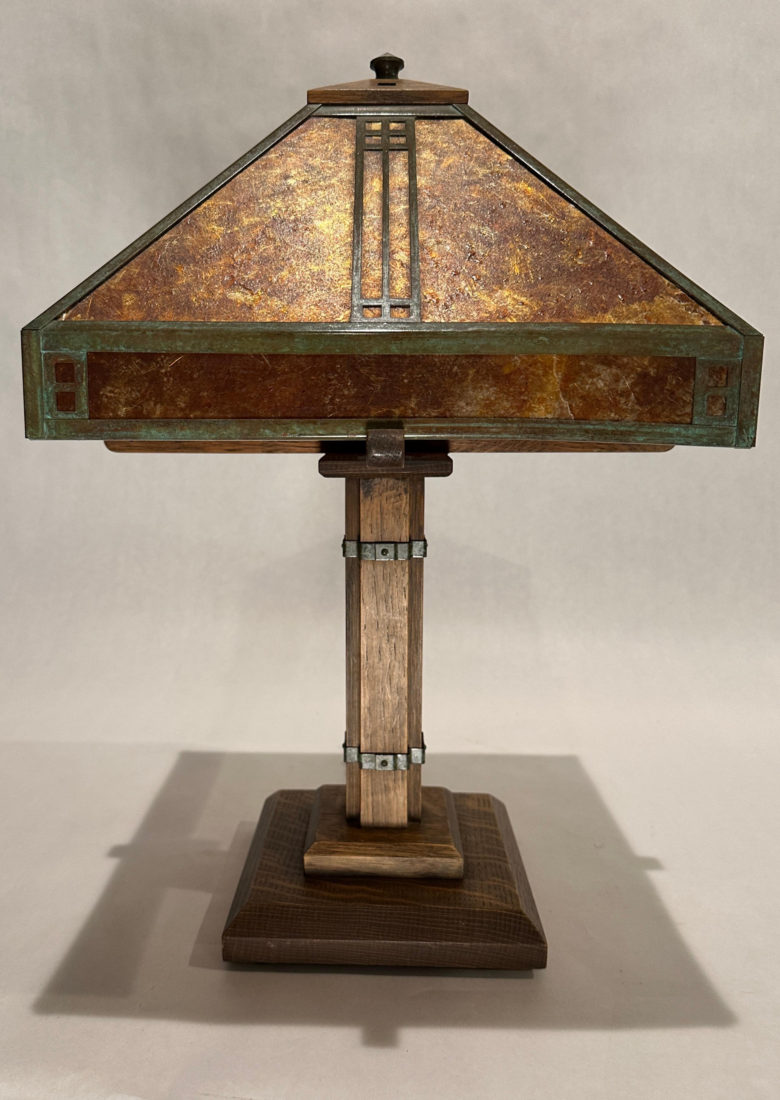 A beautiful Stickley style Arts & Crafts table lamp, produced and stamped by Warren Hile Studio, Sierra Madre CA. Base from solid oak, with a copper and mica lamp shade. Stamped on bottom by Warren Hill Studio and Arroyo Craftsman, Baldwin park, Ca.