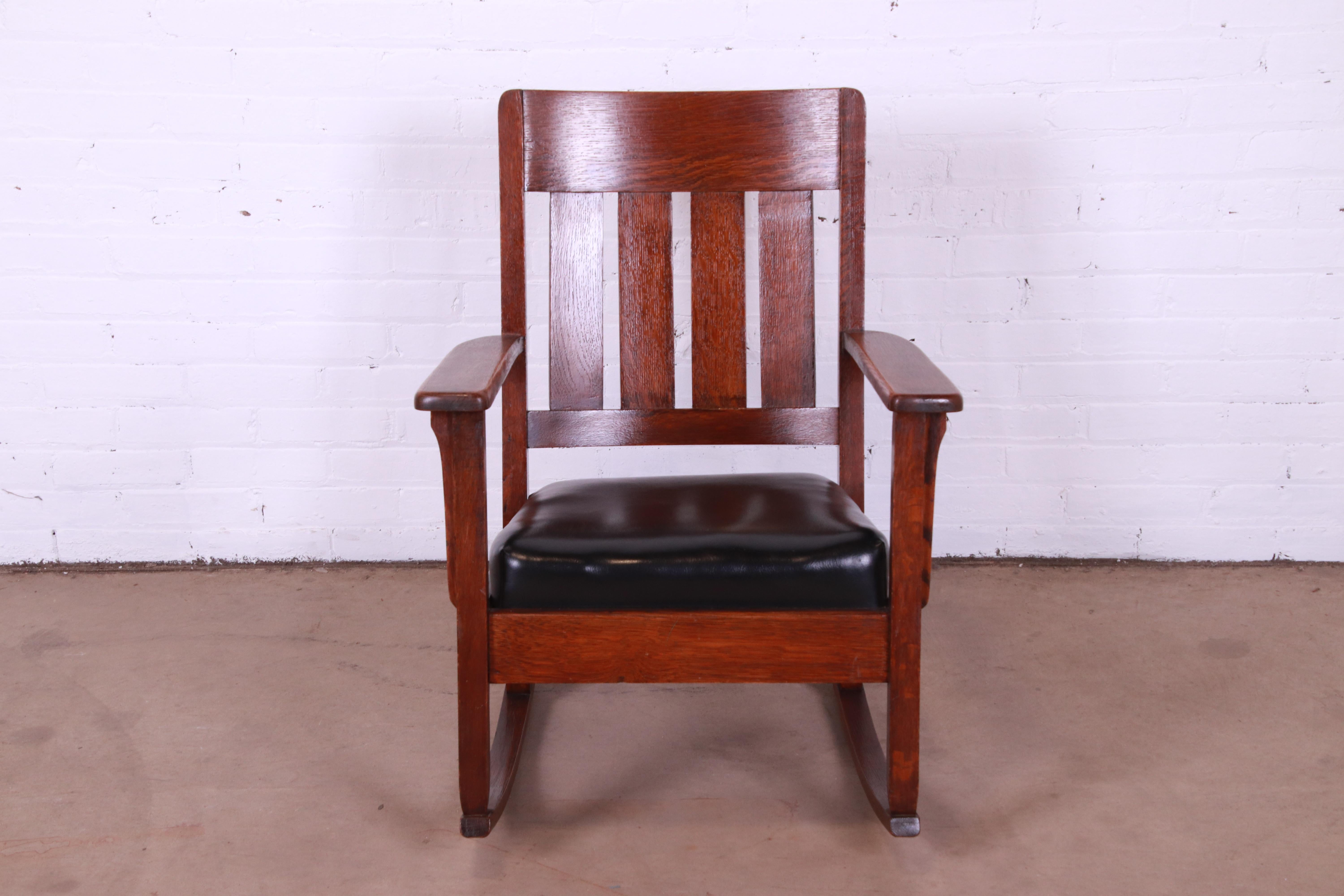 A gorgeous Mission or Arts & Crafts period rocking chair

Recently procured from Frank Lloyd Wright's DeRhodes House

In the manner of Stickley

USA, Circa 1900

Solid quarter sawn oak, with black leather upholstery.

Measures: 25.5
