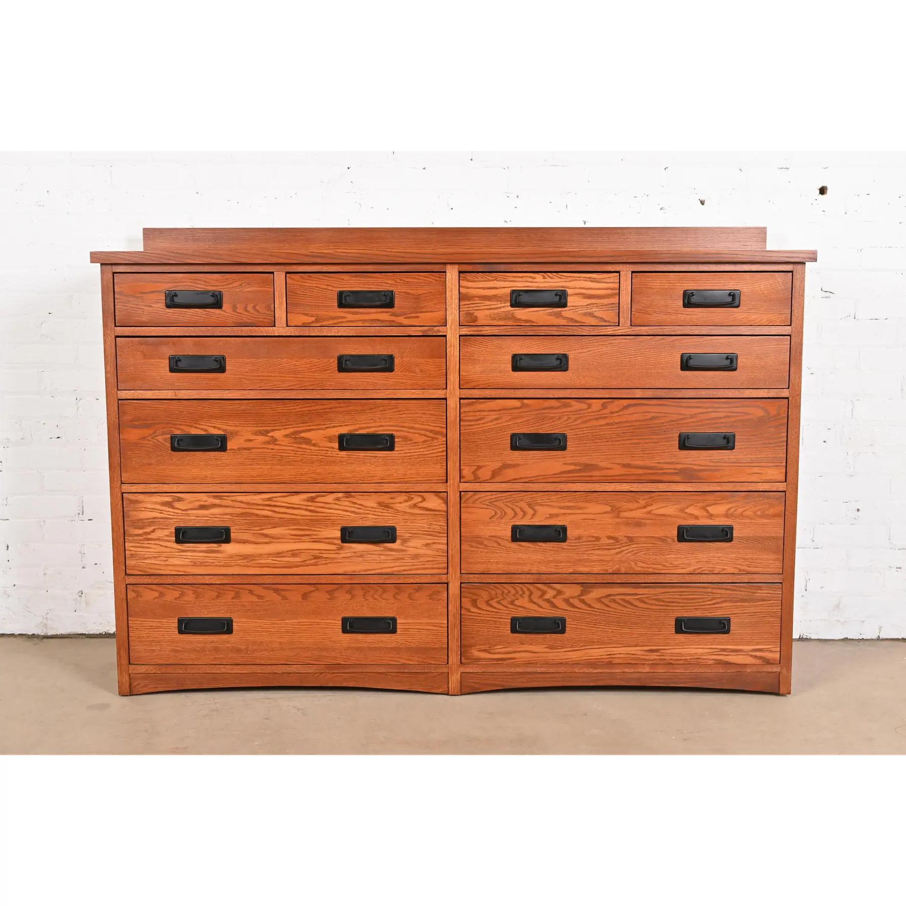 An outstanding Mission or Arts & Crafts style twelve-drawer dresser or chest of drawers

In the manner of Stickley

USA, Circa Late 20th Century

Solid oak, with cedar lined lower drawers.

Measures: 66