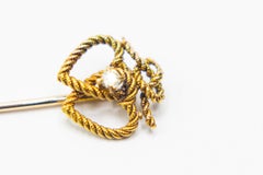 Antique double heart stick pin with a diamond