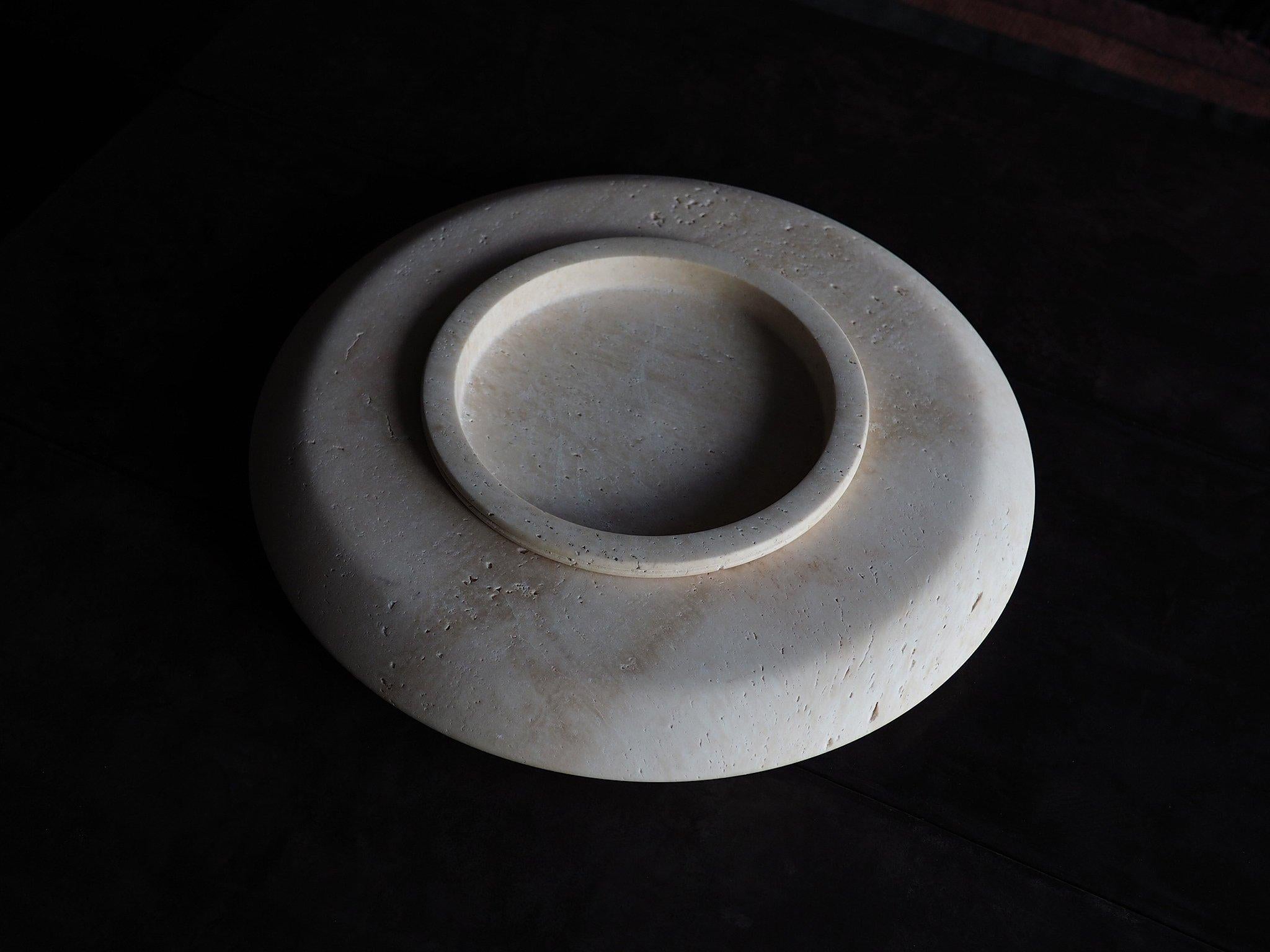 Stieglitz vessel, a natural stone heirloom in unfilled travertine. A low-slung sculptural form of two components, vessel & bowl. The finish is left unfilled, celebrating the beauty & porosity of the natural stone. The most desirable pieces expose