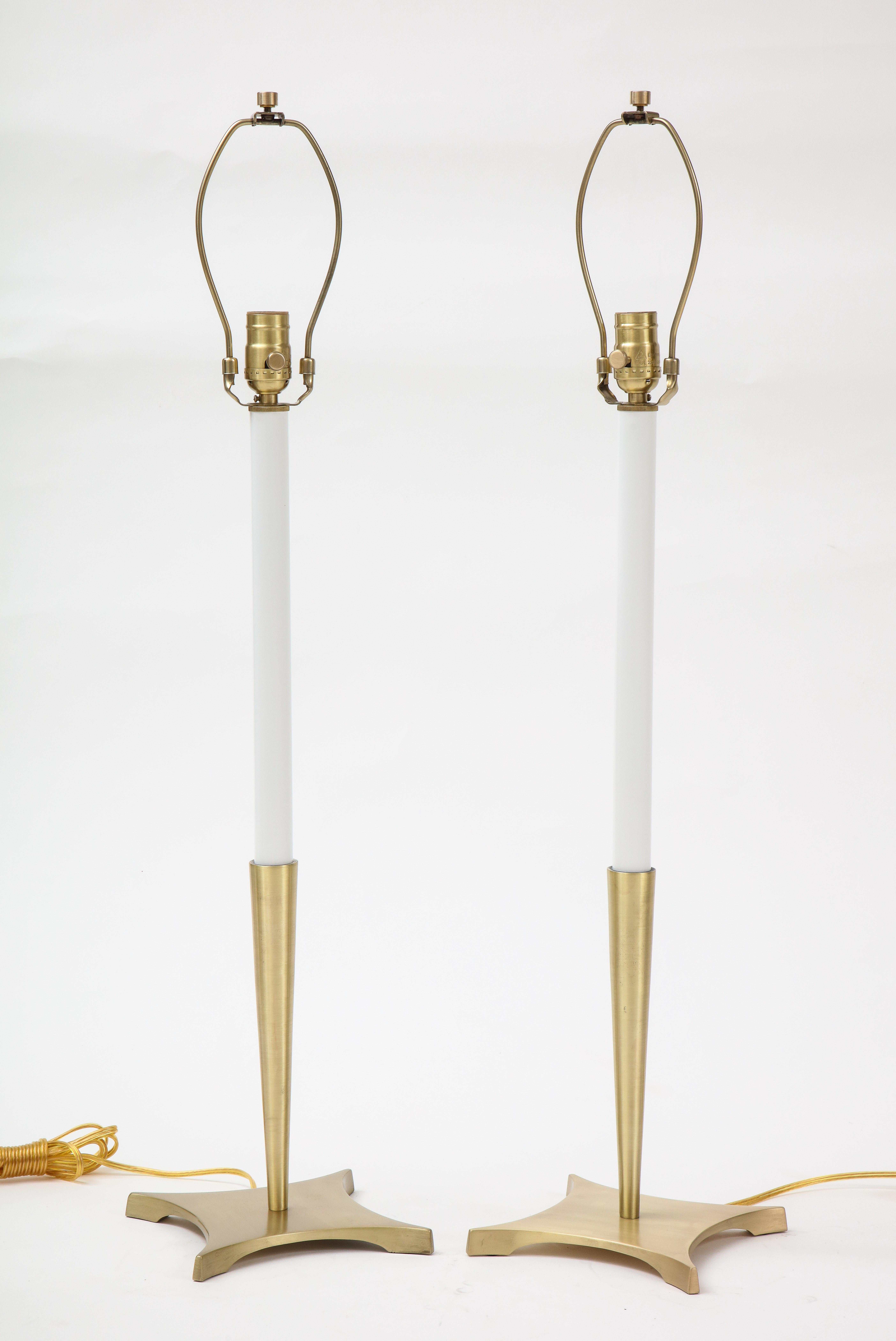 Pair of Midcentury classically styled brushed brass candlestick lamps with enameled centers. Rewired for use in USA, 100W max bulbs.