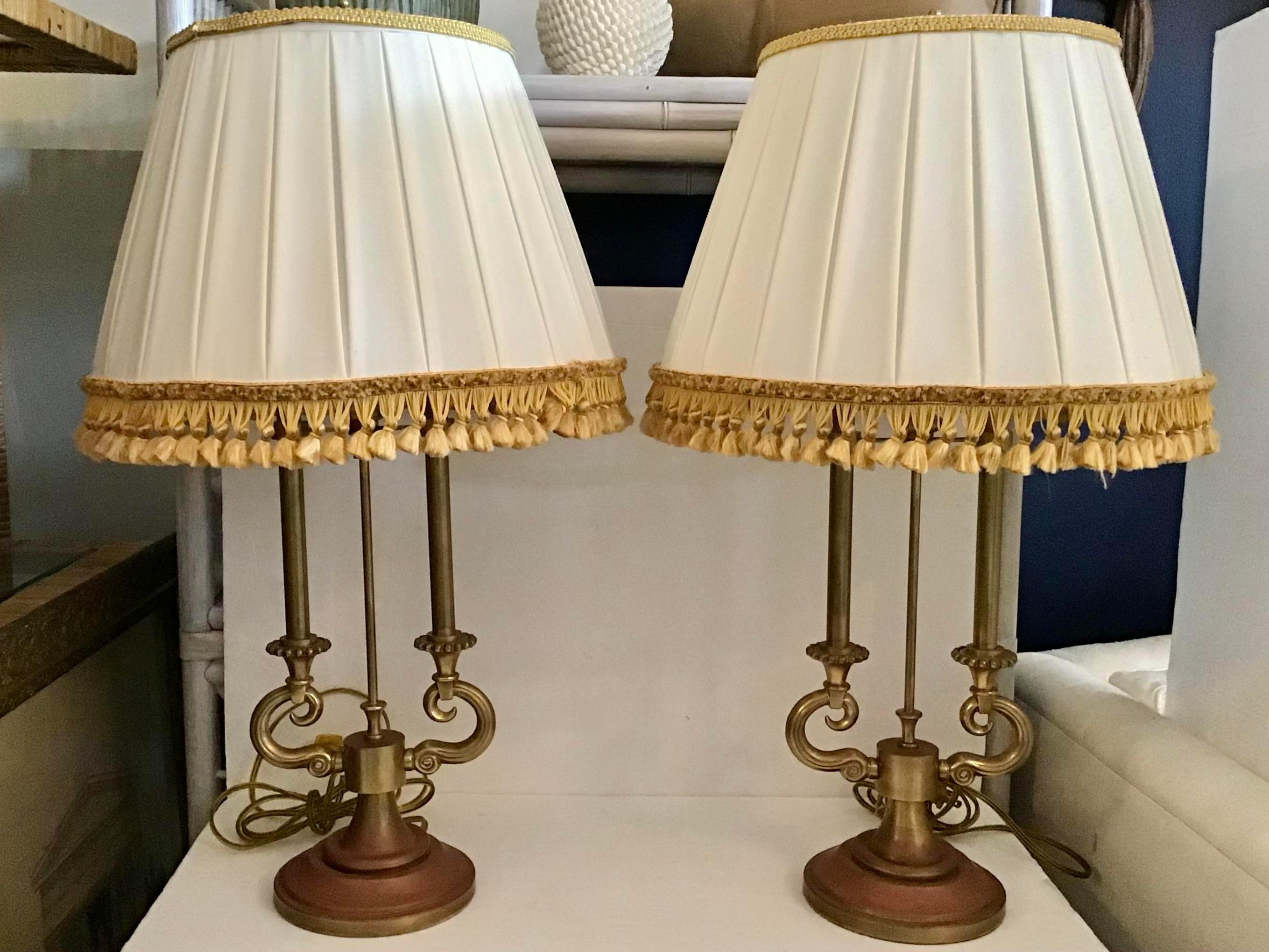 Original pair of Stiffel brass table lamps with Jansen shades with gold fringe. These gorgeous original Stiffel lamps are a warm worn brass. Notice the worn age on the bases addd real wrath to your interiors. The Jansen shades are very chic with the