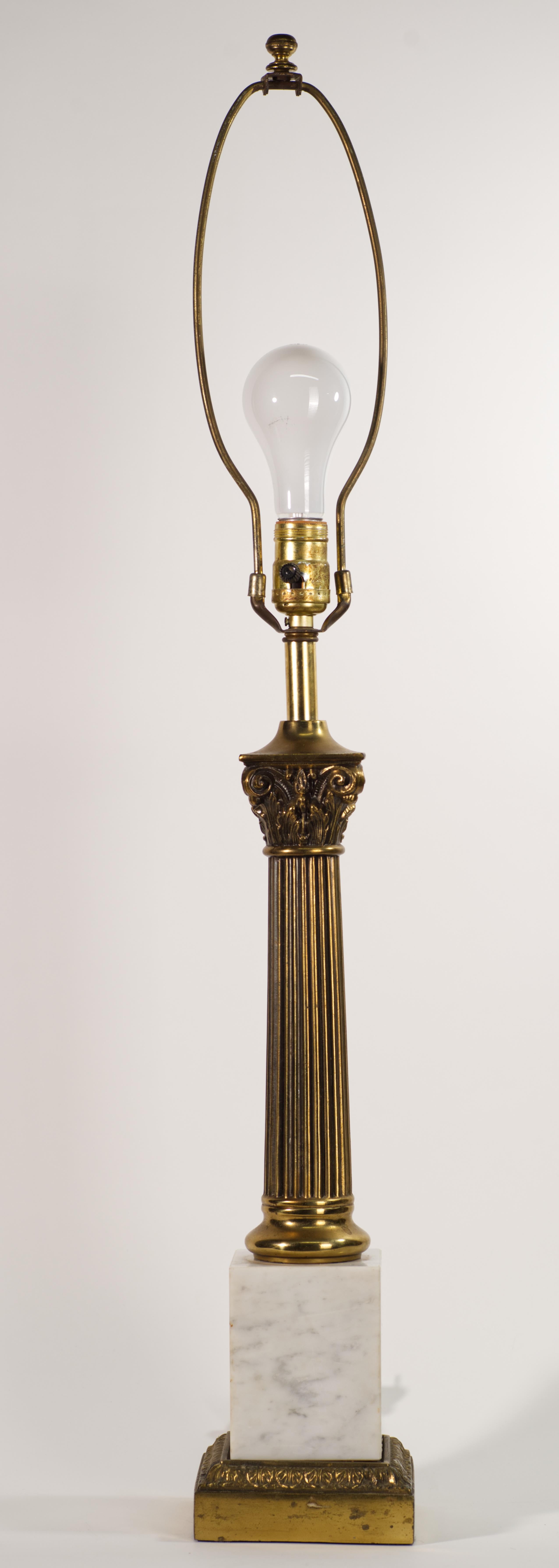  Vintage sculptural obelisk form table lamp was made by Stiffel in Hollywood Regency style; similar designs were created for Stiffel and other manufacturers by Tommi Parzinger. The lamp features brass column on rectangular light-colored marble and