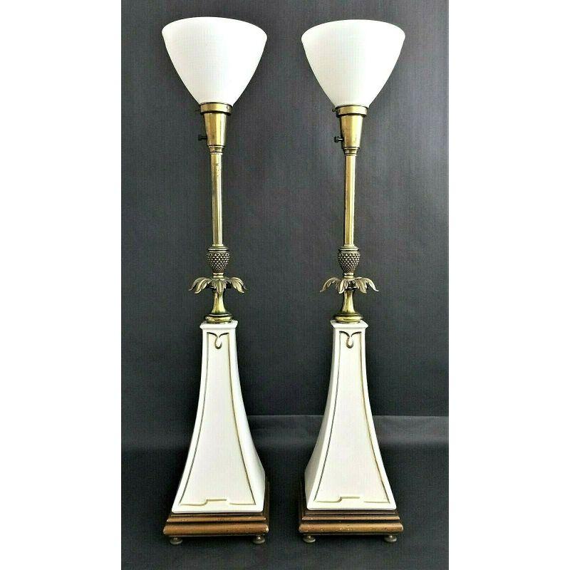 For FULL item description click on CONTINUE READING at the bottom of this page.

Offering One Of Our Recent Palm Beach Estate Fine Lighting Acquisitions Of A
Pair of Stiffel Lenox Obelisk Torchier Porcelain and Brass Table Lamps in Cream with Gold