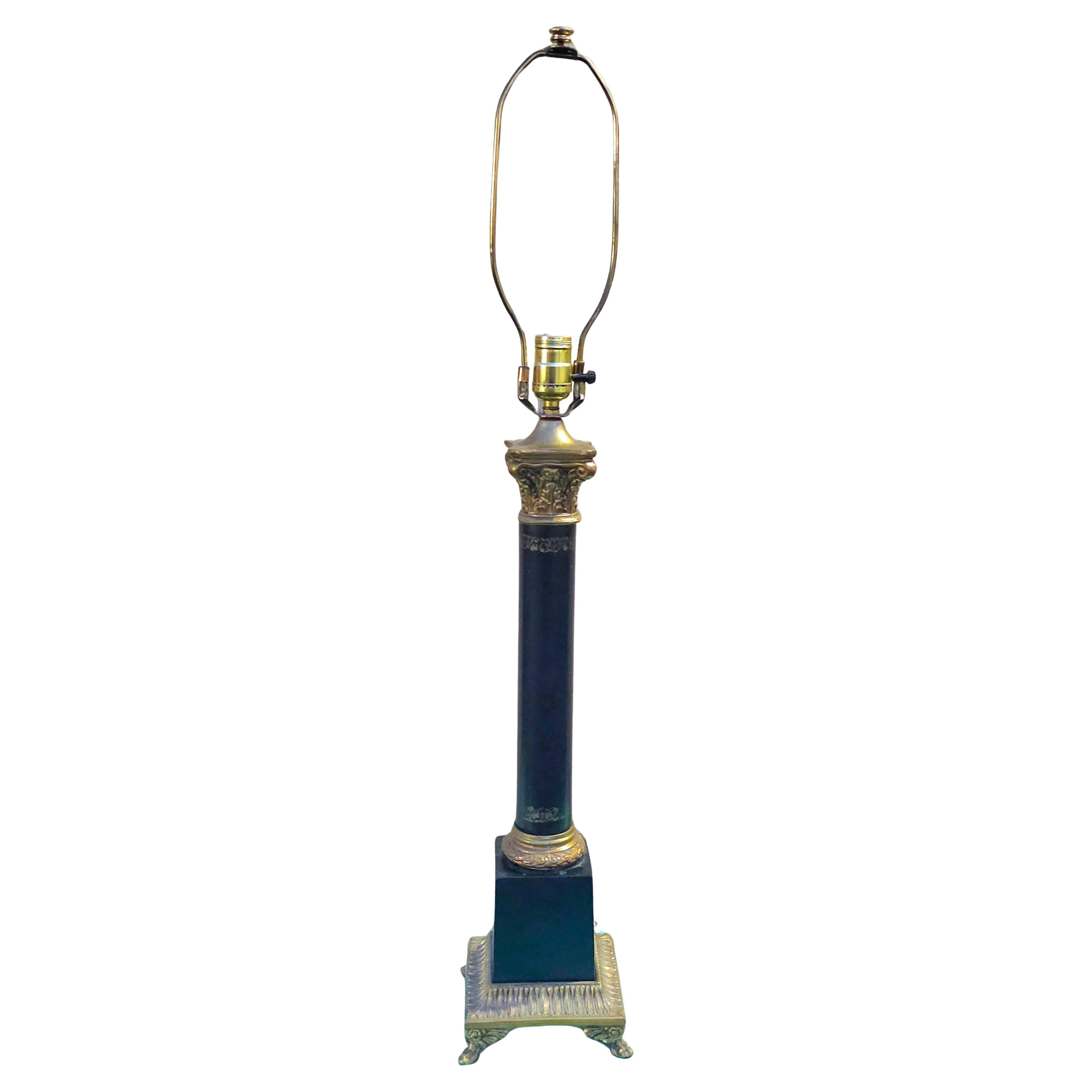 A MidCentury Stiffel Greek Corinthian Column Table Lamp with ebonized metal and brass with Paw feet
Measures 6