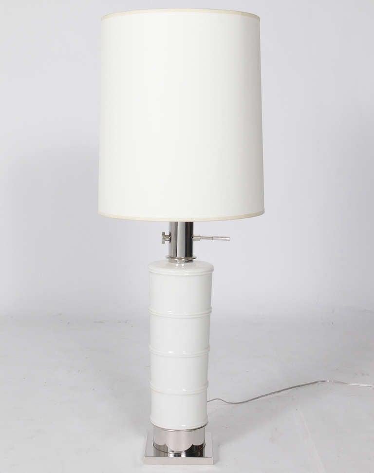 Pair of white ceramic lamps with Nickel Fittings, designed for the Stiffel Company, circa 1960s. They have been completely restored with newly nickel plated fittings. They are rewired and ready to use. The price noted in this listing is for the pair