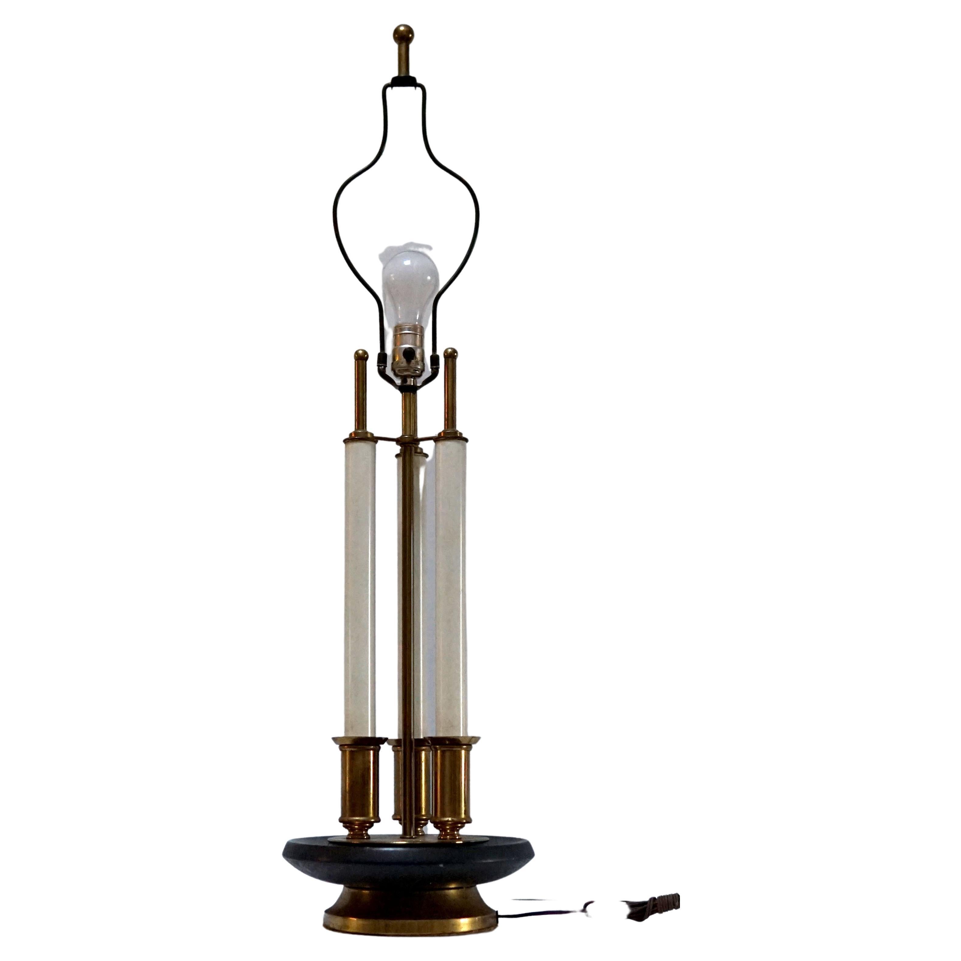 This is the epitome of statement lighting with its elegant Stiffel touches in brass with the high-style modernist design of Tommi Parzinger. Parzinger maintained a studio in New York during his lifetime and designed furniture and partnered with