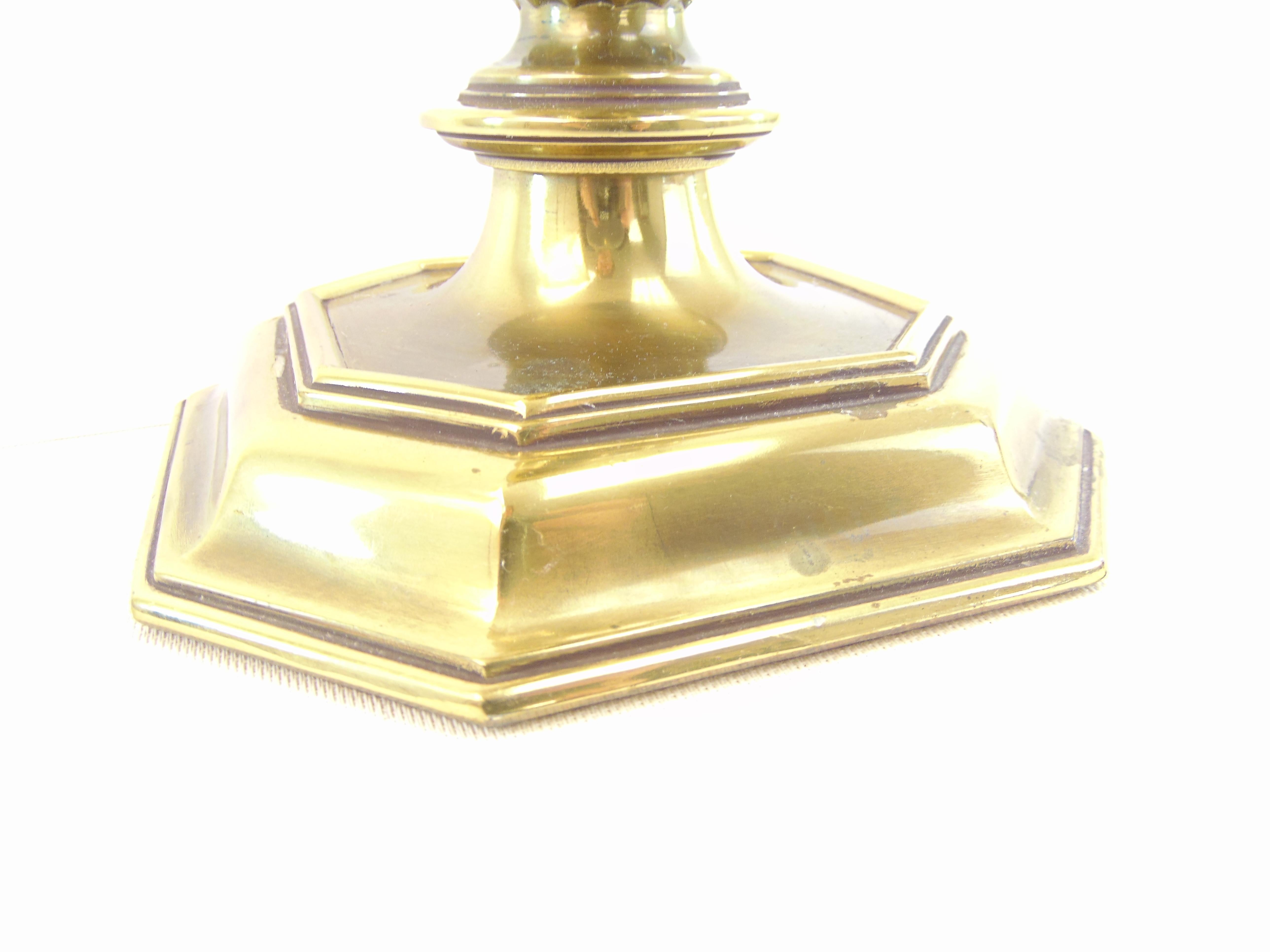 A single traditional style brass candlestick table lamp by Stiffel. The brand is stamped on the bulb socket. It is finished with the original brass finial. This lamp is a Classic American style lamp in an antique brass finish and candlestick