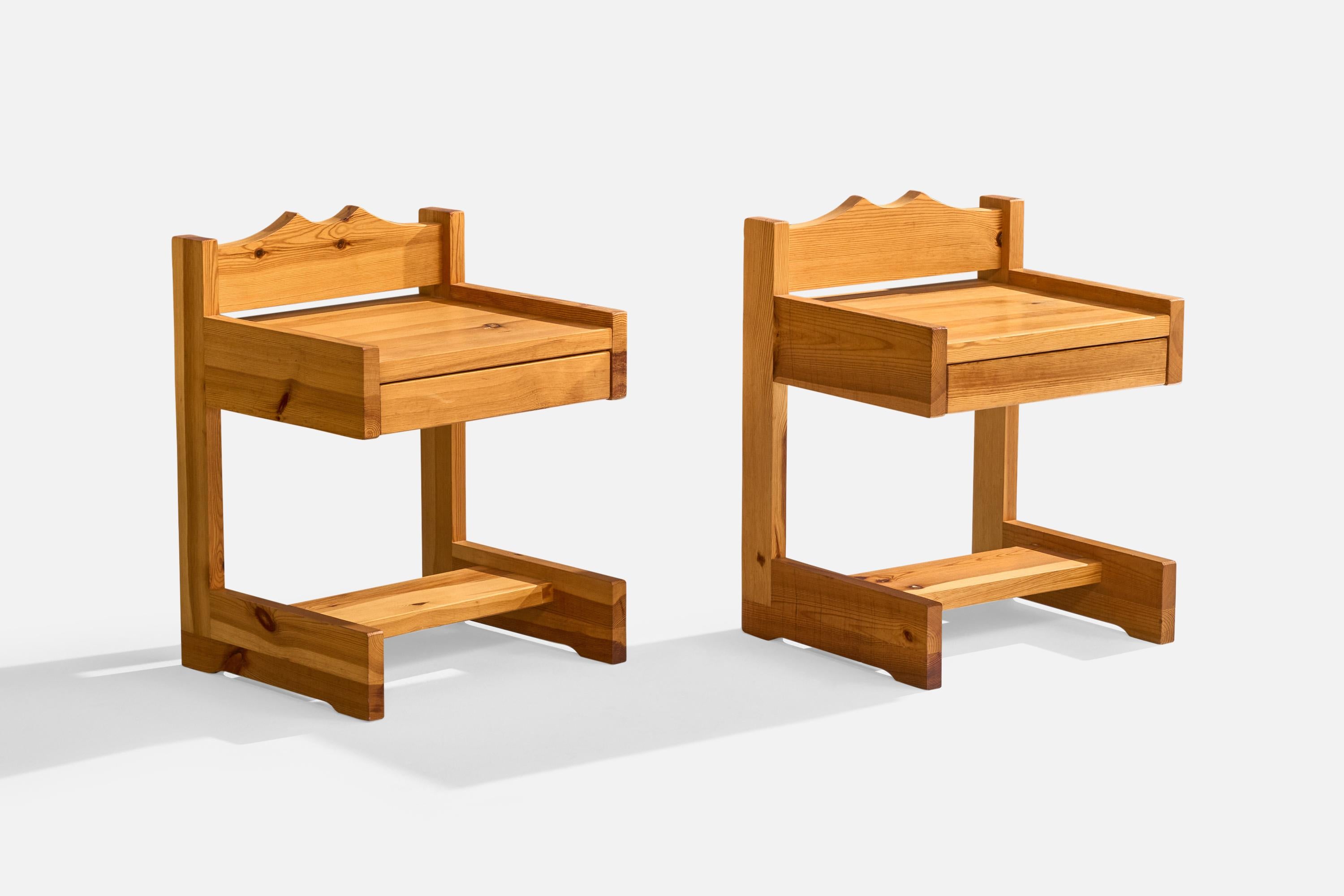 A pair of pine nightstands designed and produced by Stig Höglund, Sweden, c. 1970s.

A 2”x2” lightly discolored spot on right side of top surface on one table, and a few very small lightly discolored spots on left side of same table primarily