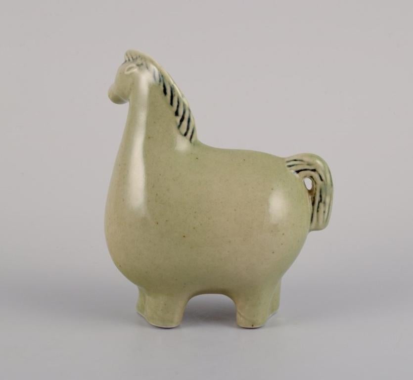 Swedish Stig Lindberg for Gustavsberg. Ceramic horse figurine with light green glaze. For Sale