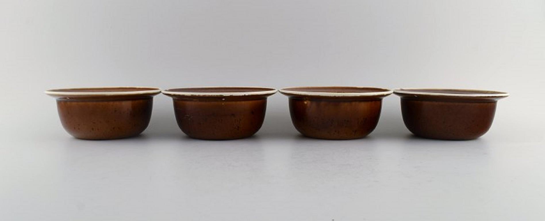 Stig Lindberg for Gustavsberg. Four Coq bowls in glazed stoneware. 
Beautiful glaze in brown shades. Swedish design, 1960s.
Measures: 16 x 6.5 cm.
In excellent condition.
Stamped.