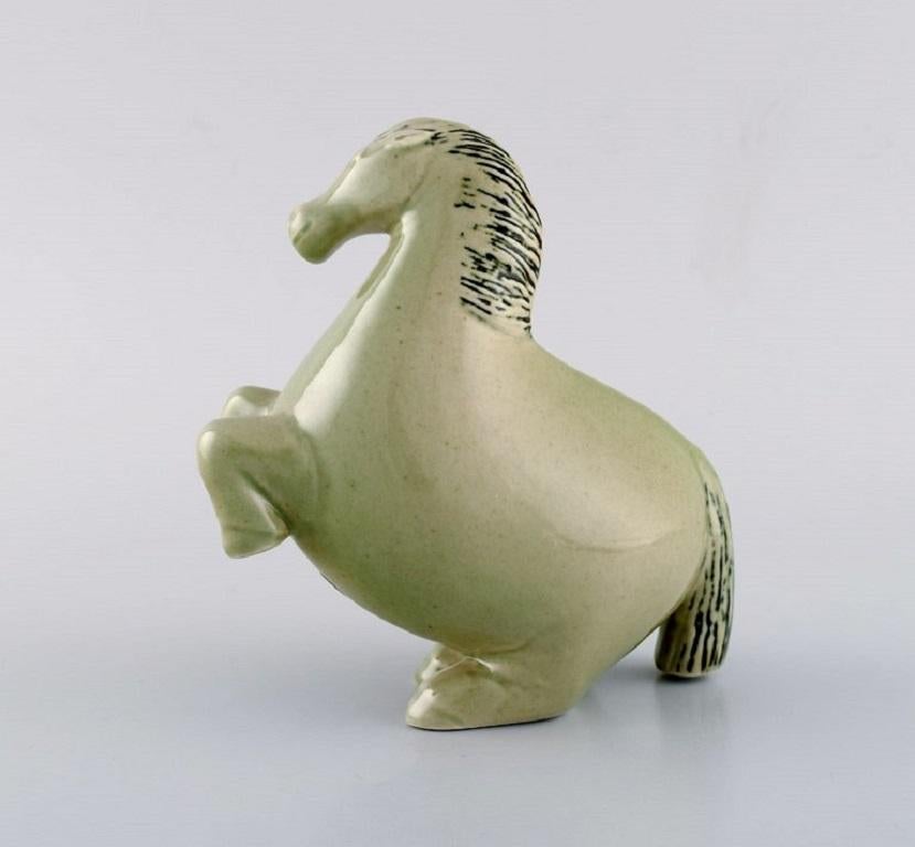 Stig Lindberg for Gustavsberg. Horse figure of stoneware, decorated with green Celadon glaze. 1950's.
Made and marked for Gustavsberg, Sweden.
Measures: 13,5 x 13 cm.
In excellent condition.