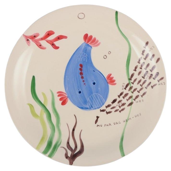 Stig Lindberg for Gustavsberg. Löja plate, hand-painted with a fish motif.