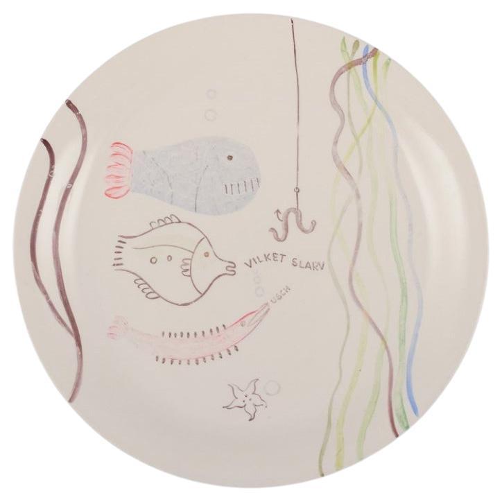Stig Lindberg for Gustavsberg. "Löja" plate. Hand-painted with fish motif, 1950s For Sale