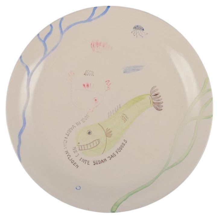 Stig Lindberg for Gustavsberg. "Löja" plate. Hand-painted with fish motif. For Sale