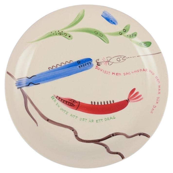 Stig Lindberg for Gustavsberg. "Löja" plate with a fish motif, 1950s For Sale