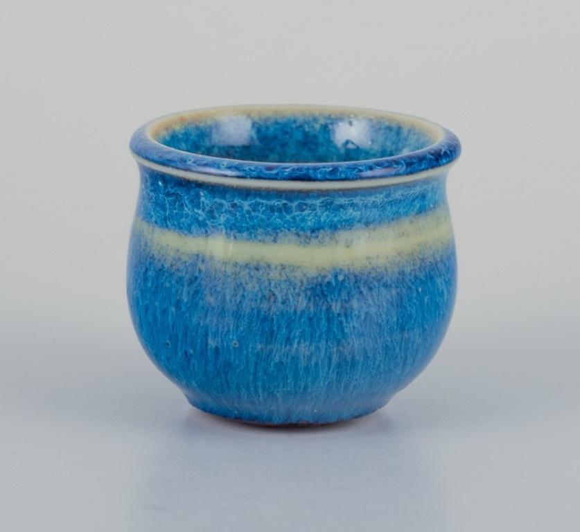Stig Lindberg (1916-1982), Gustavsberg Studio.
Miniature vase in blue glaze.
1960s.
Signed.
Perfect condition.
Dimensions: H 22 mm x D 25 mm.