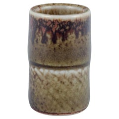 Stig Lindberg for Gustavsberg Studio. Miniature vase with green-brown glaze. 