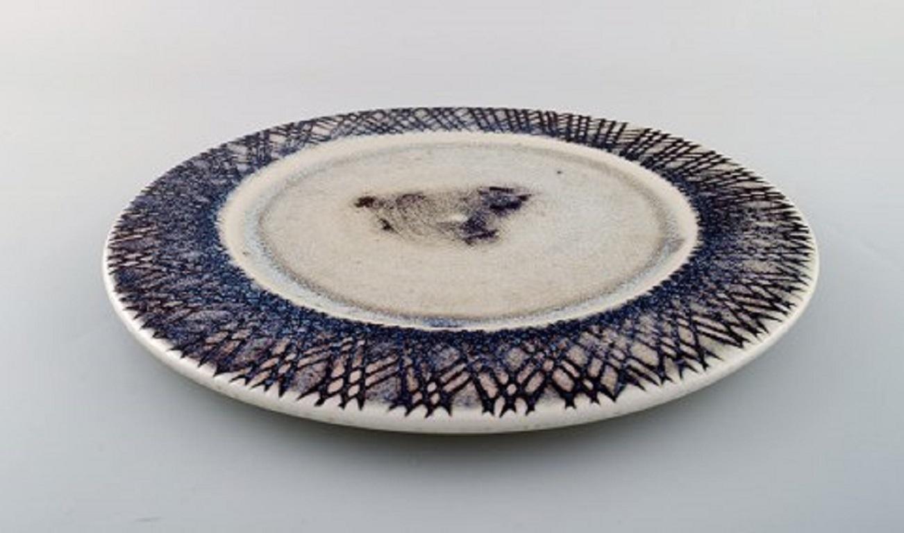 Stig Lindberg for Gustavsberg Studio. Large dish in glazed ceramics. Beautiful glaze in violet tones. Swedish design, mid-20th century.
Measures: 32 cm.
Stamped.
In perfect condition.

    