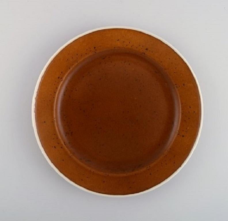 Stig Lindberg for Gustavsberg. Twelve Coq dinner plates. Beautiful glaze in brown shades, 1960s.
Measures: Diameter 24.5 cm.
In excellent condition.
Stamped.