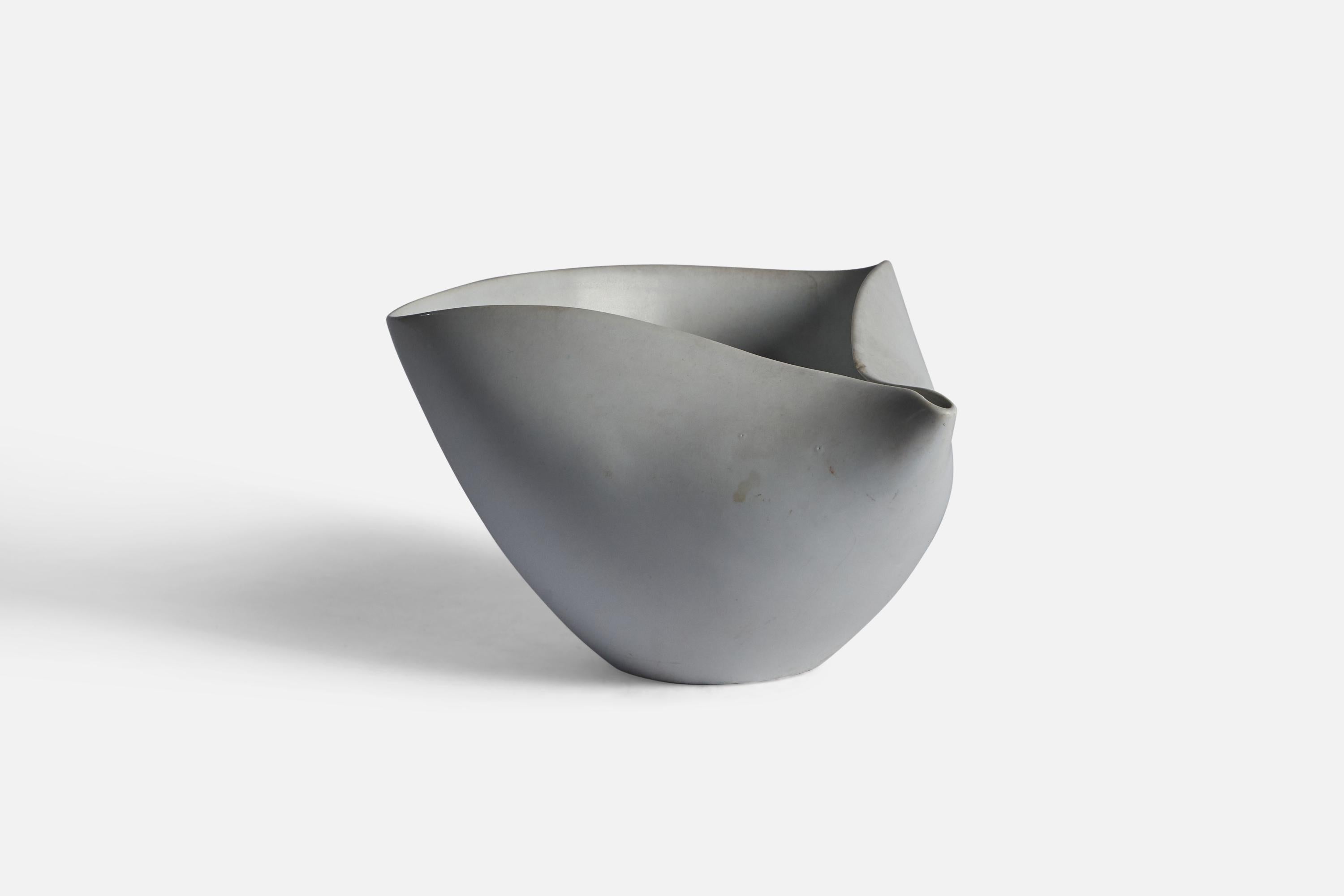 A white-glazed stoneware bowl, model 