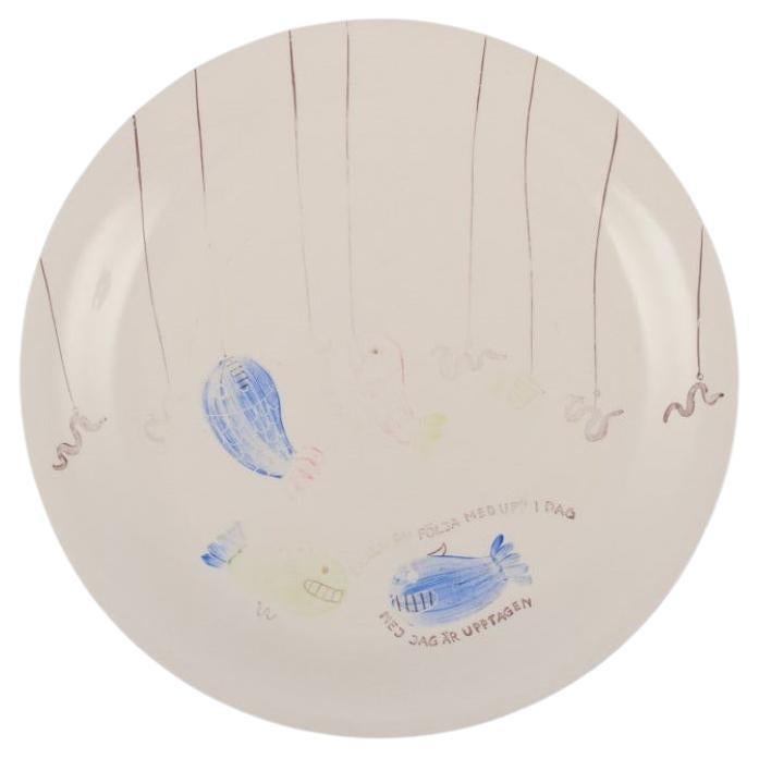 Stig Lindberg, Gustavsberg. "Löja" plate. Hand-painted with fish motif, 1950s For Sale