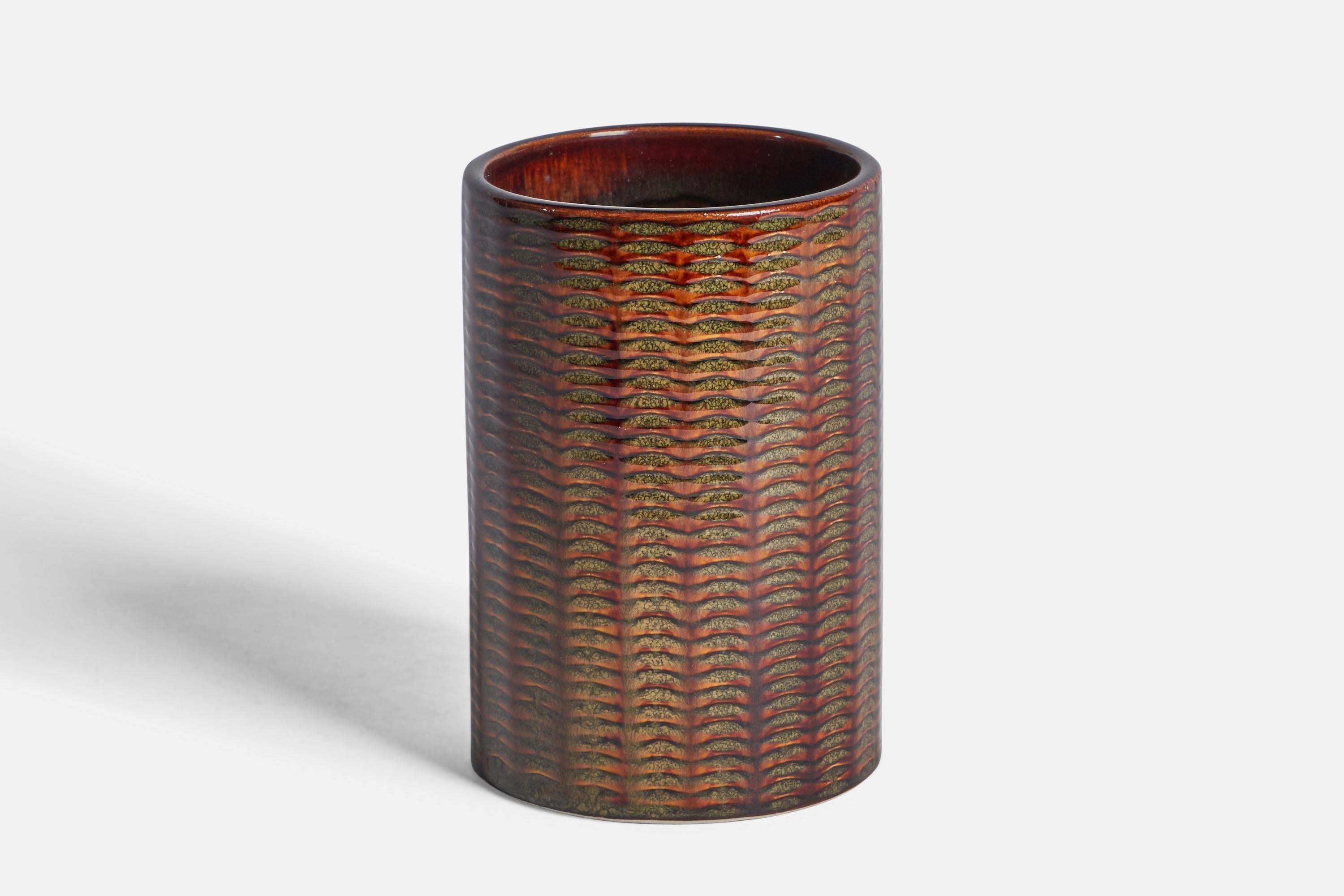 A red and green-glazed stoneware vase designed by Stig Lindberg and produced by Gustavsberg, c. 1960s.