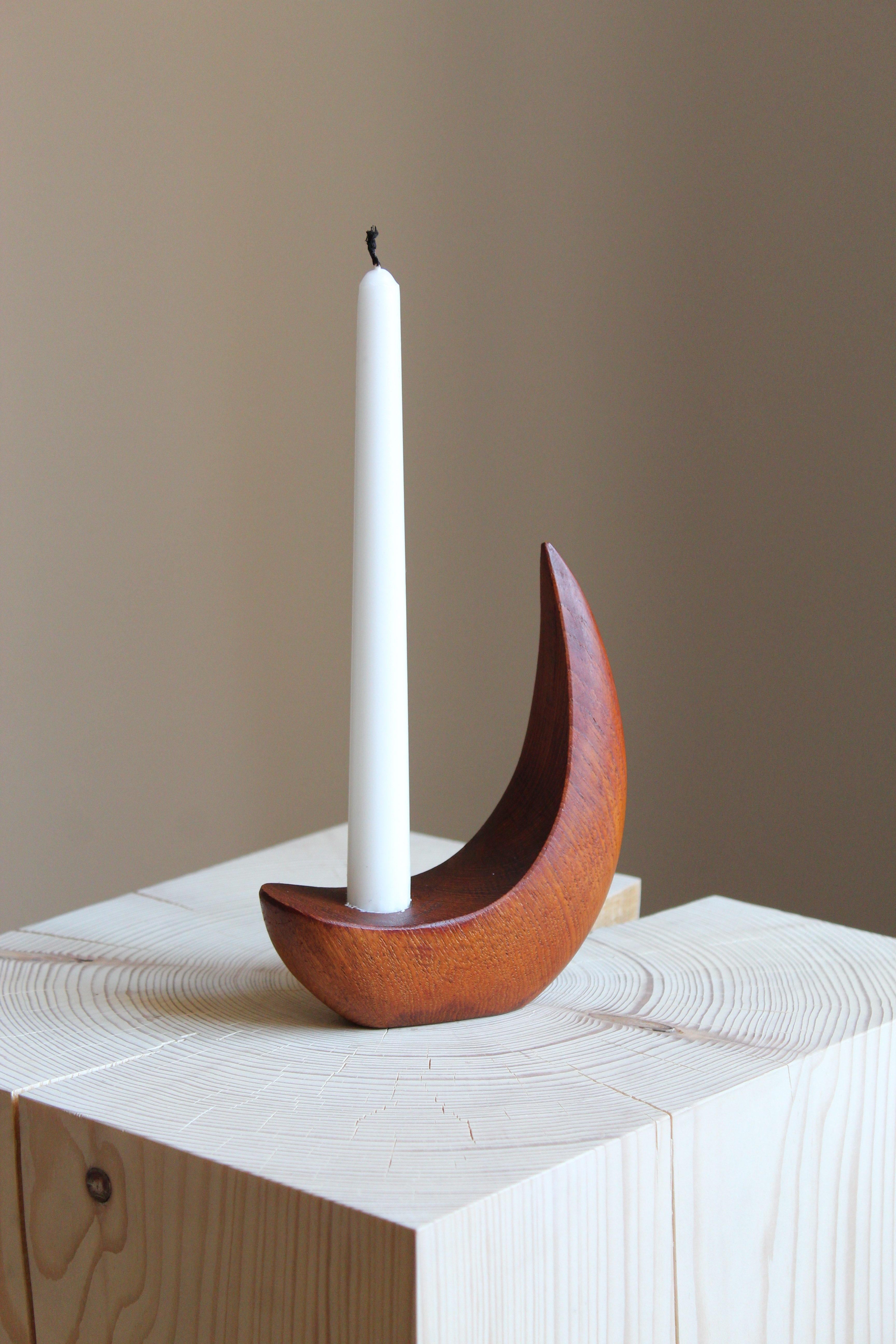 A candlestick / sculpture by Stig Sandberg. Handmade in his studio. Features carved initials

Other designers of the period include Finn Juhl, Hans Wegner, Kaare Klint, and Alvar Aalto.