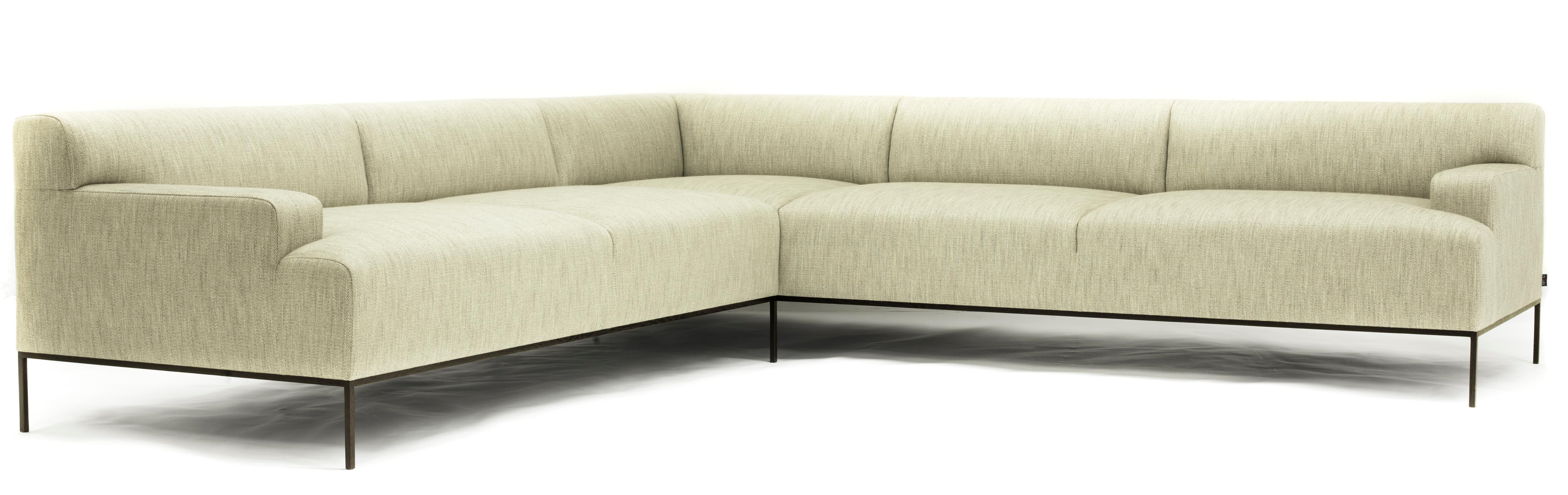 The Stiletto sectional is sophisticated and plush. Its sleek wengé frame and rich upholstery make this piece a perfect balance of comfort and luxury.