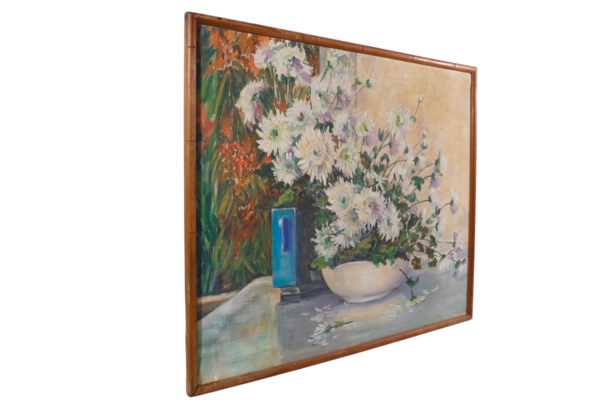 An original still life impressionist oil on canvas. The scene depicts abundant white gerbera daisies in a square cobalt blue vase and a white bowl, set on a table by a wall, seemingly outside, with bromeliads in the background to the left. Signed in
