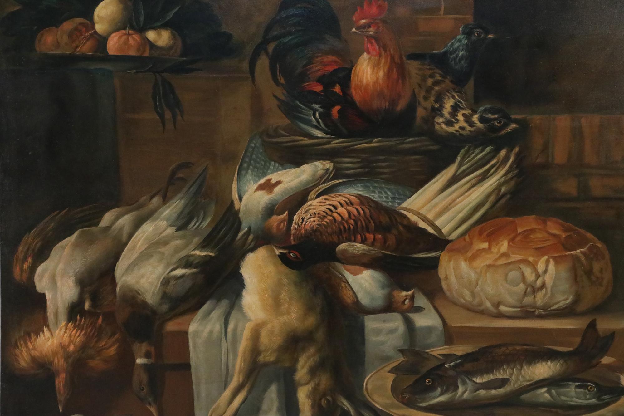 Vintage (20th Century) richly-captured still life of game birds, rabbit and fowl laid out on a butcher block alongside a rounded loaf of bread, fish in a bowl in the foreground across from a sniffing dog, and fowl in a propped-up basket overlooking