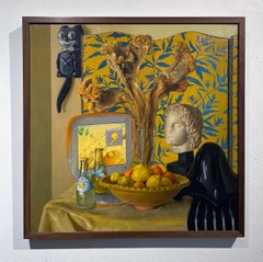 Bodegón contemporáneo con busto de Alejandro Magno y iBook de Apple naranja