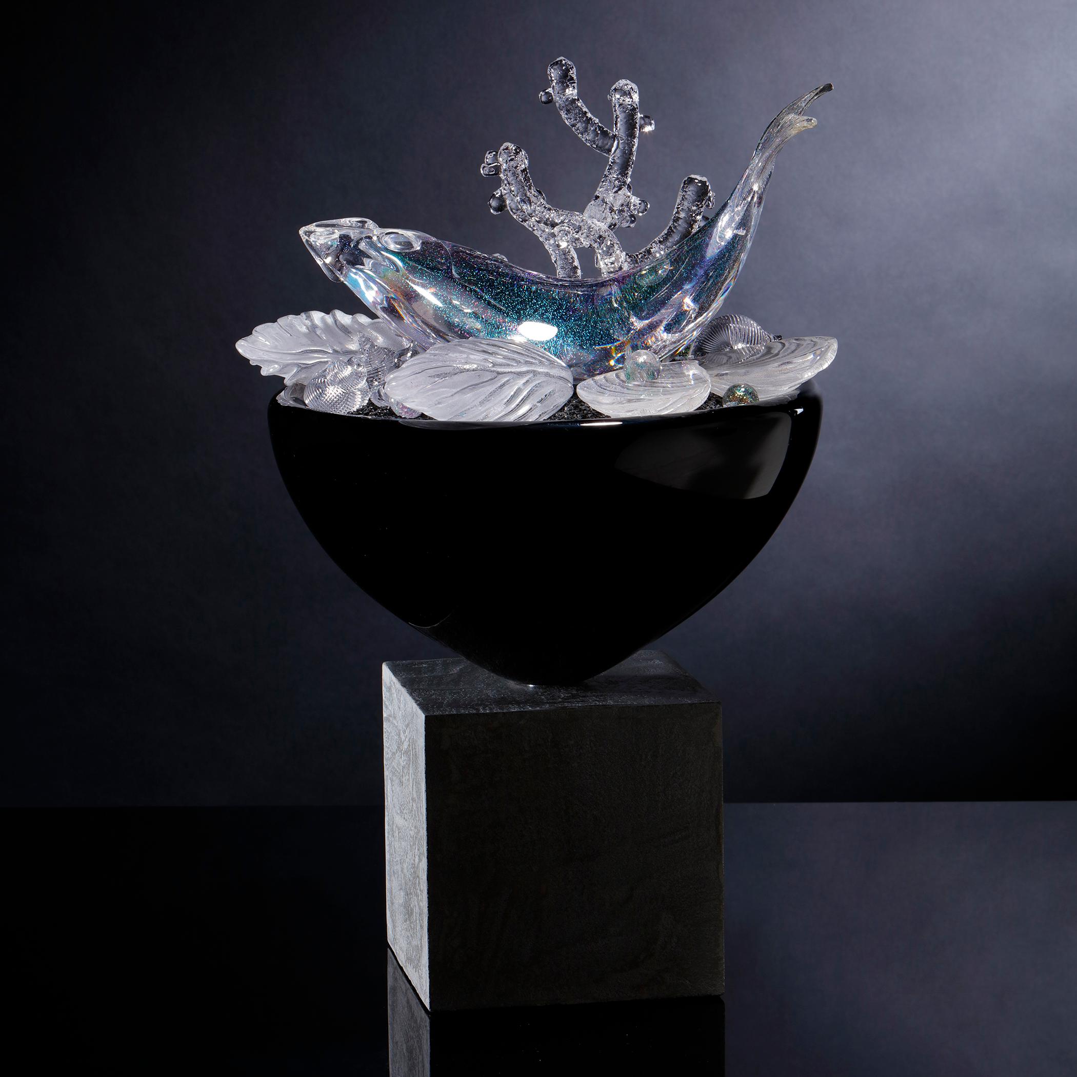 Still Life with Fish & Molluscs is one of the British artist Elliot Walker's ongoing body of unique still life artworks. Freehand sculpted in clear and black glass with iridescent detail, the piece incorporates an elegant black centrepiece adorned