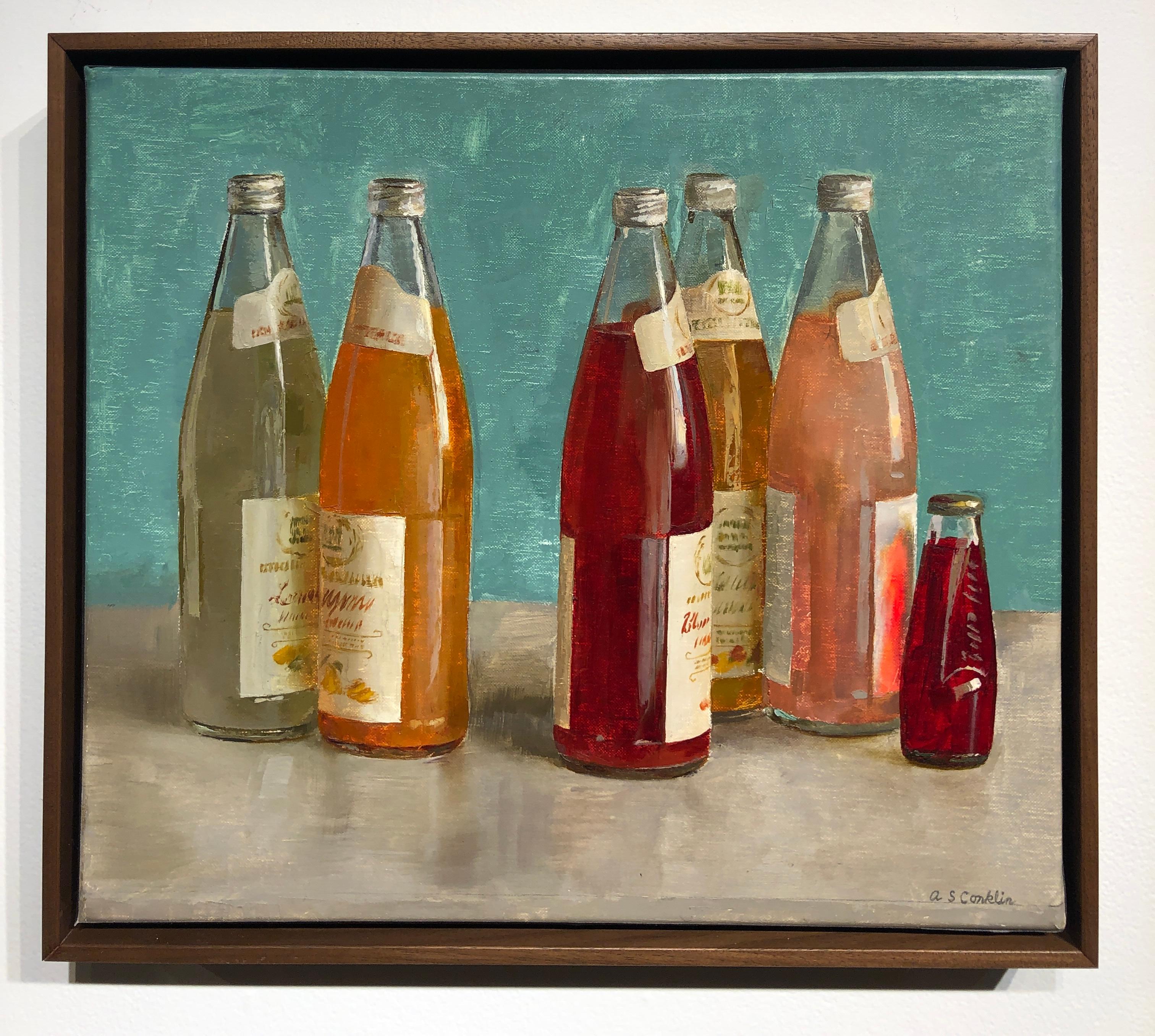 Still Life painting, with origins dating back to the 16th Century, often depicts simple everyday objects. Conklin uses richly colored Italian Soda bottles to play with placement and composition. Set on a gray table, the rich reds and corals of the