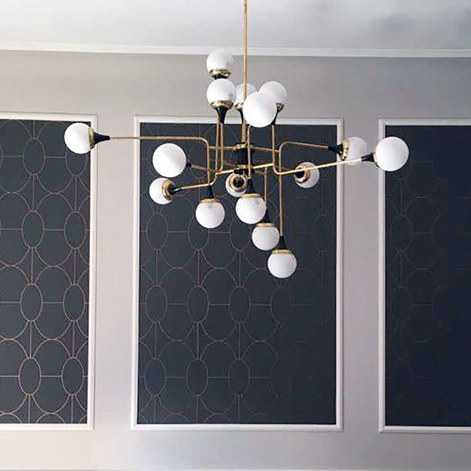 Marvelous Italian chandelier with 16 lights, made after a 1959 Stilnovo design.
Black painted metal, brass and opaline glass shades. 

Dimensions:
115 x 115 cm. (45 x 45 In.)
Height adjustable upon request.