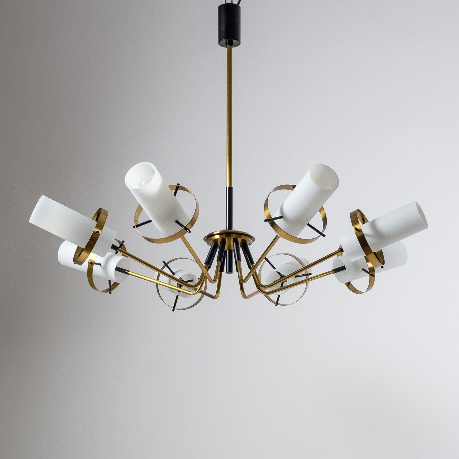 Excellent brass Sputnik chandelier attributed to Stilnovo, 1958. The hardware is made entirely of brass, partially lacquered in black. Each of the eight-arm has a 