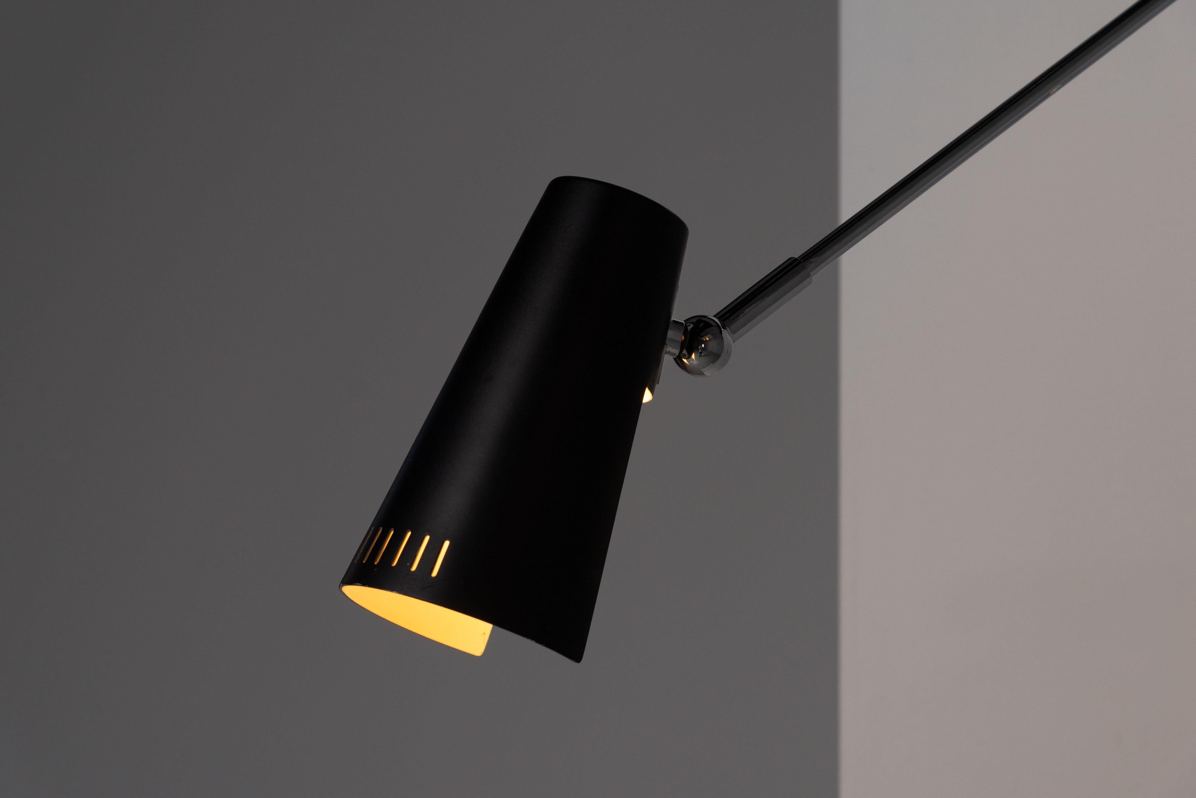 Very nice adjustable model 2024 wall lamp designed and manufactured by Stilnovo, Italy 1960. This chrome-plated lamp is notable for its adjustable features offering flexibility in its positioning. It has a conical-shaped black aluminium shade with