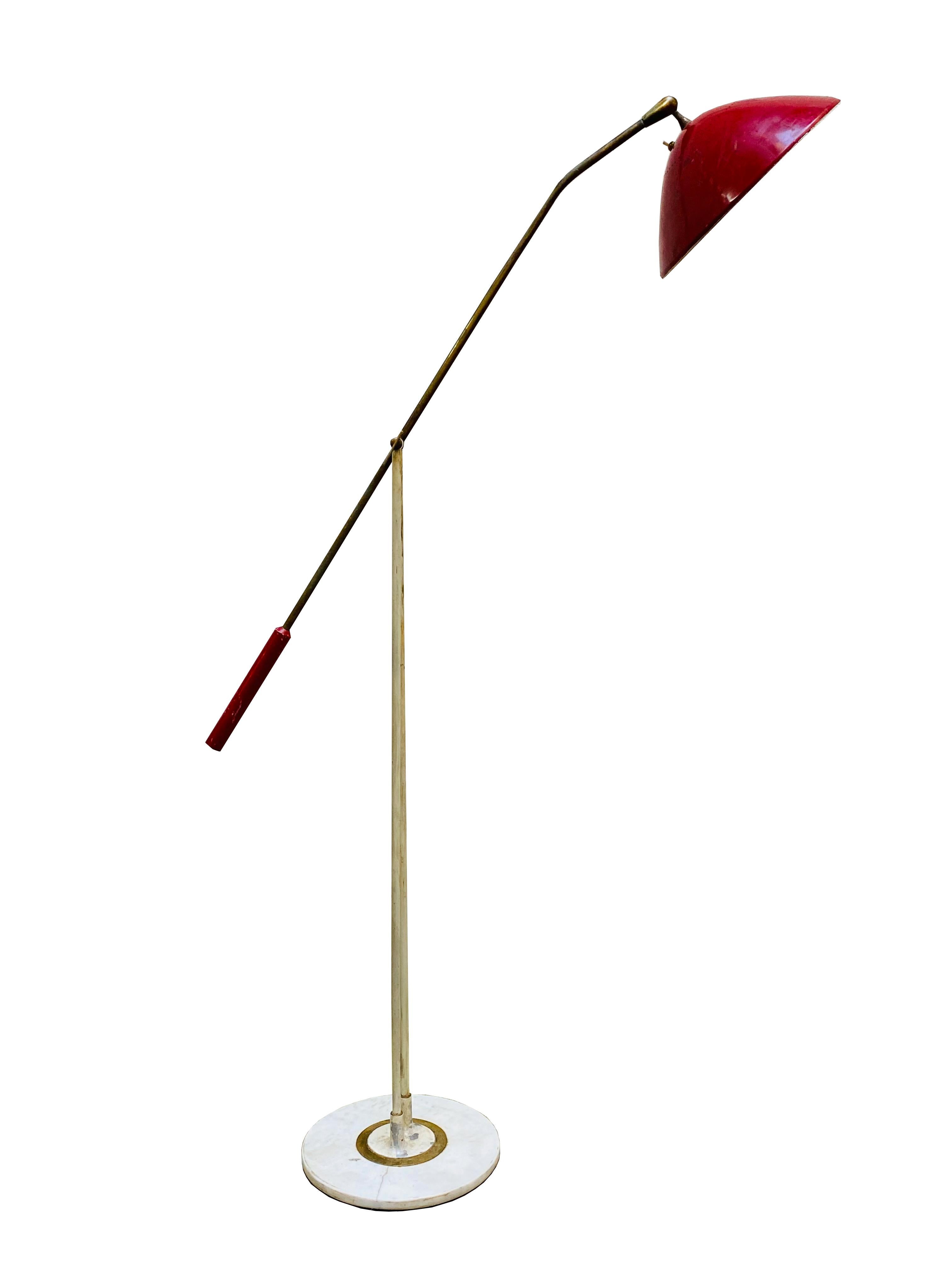 Floor lamp with brass swivel and directional arm, red lacquered metal shade and white marble base, Stilnovo 1950.