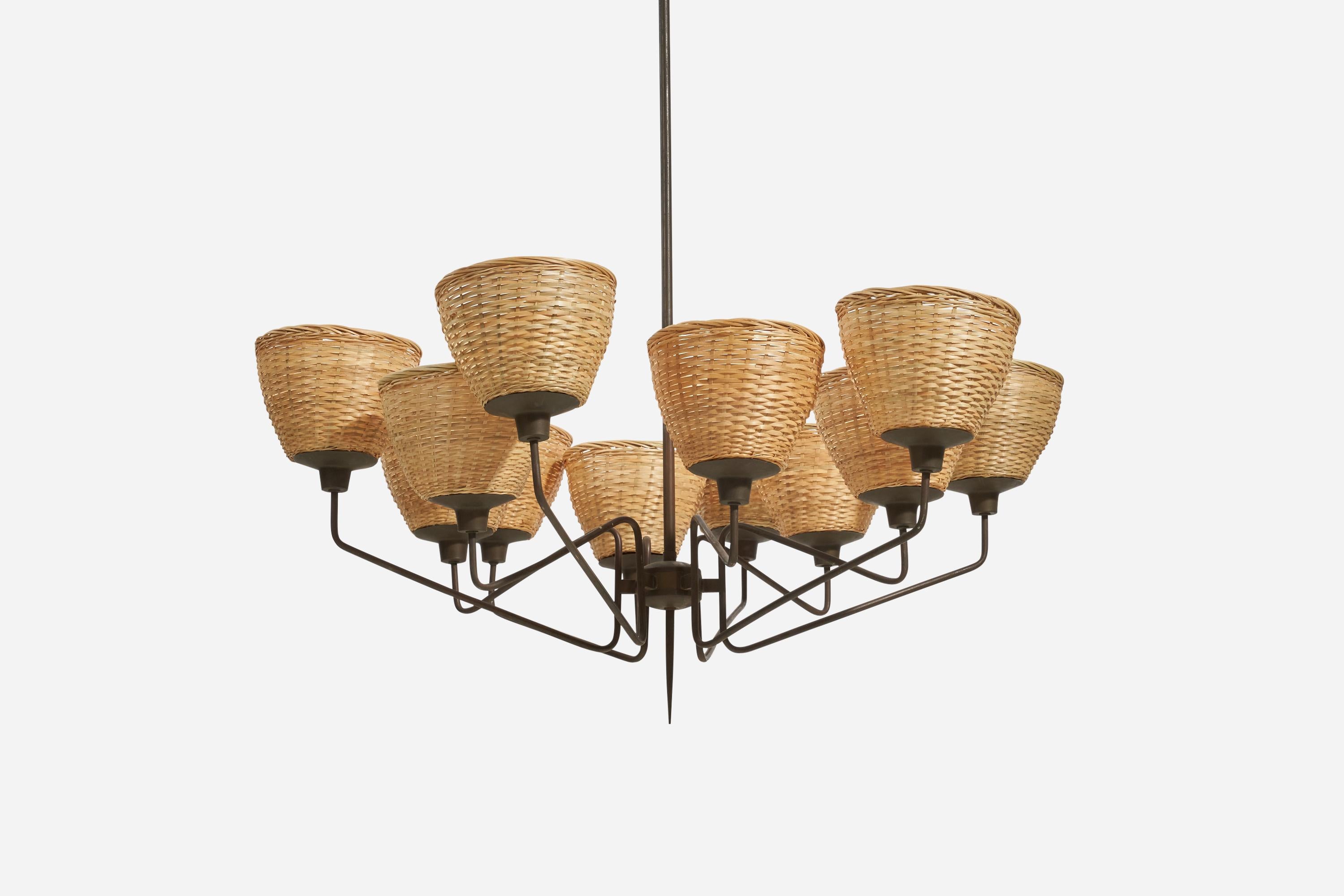 A sizeable brass and rattan chandelier; design and production attributed to Stilnovo, Italy, 1960s. 

There is no maximum wattage stated on the fixture.