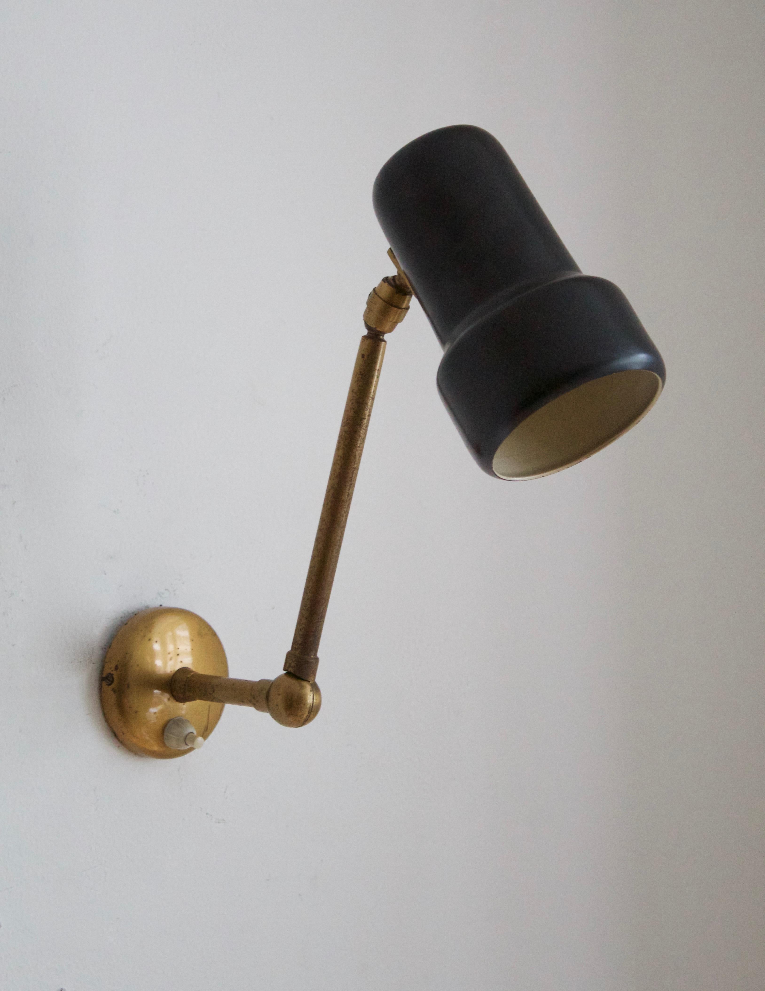 A wall light light, design and production attributed to Stilnovo, Italy, 1950s. Features brass and black lacquered metal.

Other designers of the period include Angelo Lelii, Gino Sarfatti, Max Ingrand, Serge Mouille.

     