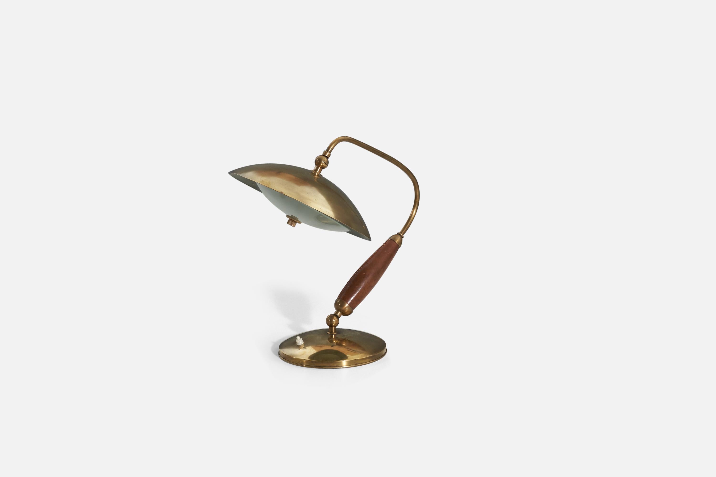 An adjustable table lamp is attributed to Stilnovo and was produced in Italy 1950s. Composed of brass, leather, and frosted glass.

The dimensions listed are of the lamp in photographed position.