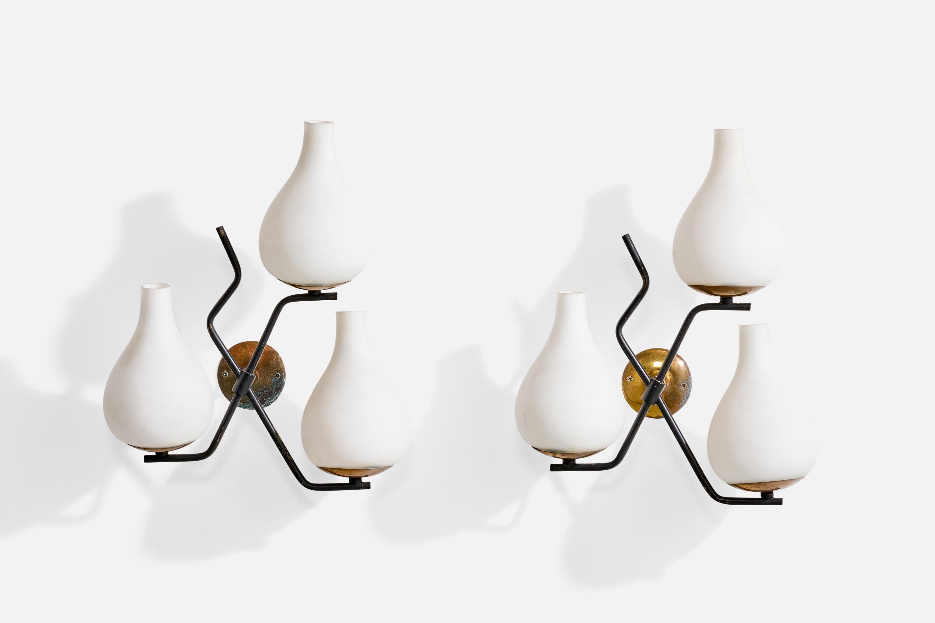 A pair of brass, black-lacquered metal and white opaline glass wall lights attributed to Stilnovo, Italy, c. 1950s.

Overall Dimensions (Inches): 15” H x 11” W x 6“ D

Back Plate Dimensions (Inches): 2.75” H x 2.75” W x .9” D

Bulb Specifications: